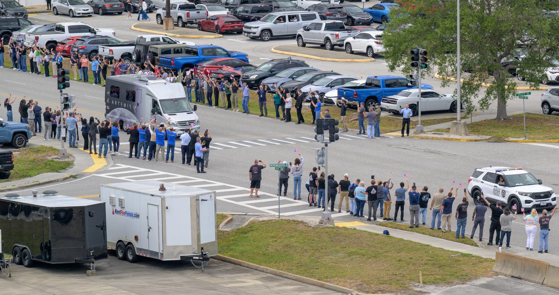 The astrovan with NASA astronauts Reid Wiseman, commander; Victor Glover, pilot; Christina Koch, mission specialist; and CSA (Canadian Space Agency) astronaut Jeremy Hansen, mission specialist drives by NASA employees on the way to the launch pad ahead of the crew boarding their Orion spacecraft atop NASA’s Space Launch System (SLS) rocket at Launch Complex 39B, Wednesday, April 1, 2026, at NASA’s Kennedy Space Center in Florida. NASA’s Artemis II mission will take Wiseman, Glover, Koch, and Hansen on a 10-day journey around the Moon and back aboard their Orion spacecraft from Launch Complex 39B, with a two hour launch window opening at 6:24pm EDT. Photo Credit: (NASA/Bill Ingalls)