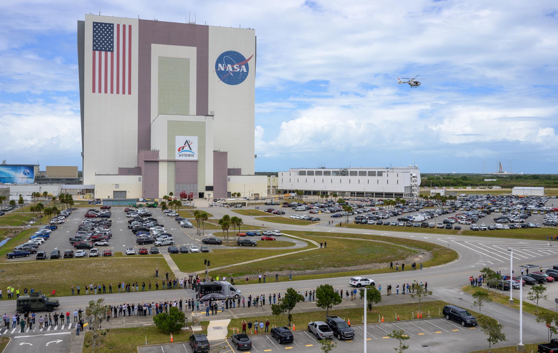 The astrovan with NASA astronauts Reid Wiseman, commander; Victor Glover, pilot; Christina Koch, mission specialist; and CSA (Canadian Space Agency) astronaut Jeremy Hansen, mission specialist drives by the Vehicle Assembly Building (VAB) to the launch pad ahead of the crew boarding their Orion spacecraft atop NASA’s Space Launch System (SLS) rocket at Launch Complex 39B, Wednesday, April 1, 2026, at NASA’s Kennedy Space Center in Florida. NASA’s Artemis II mission will take Wiseman, Glover, Koch, and Hansen on a 10-day journey around the Moon and back aboard their Orion spacecraft from Launch Complex 39B, with a two hour launch window opening at 6:24pm EDT. Photo Credit: (NASA/Bill Ingalls)