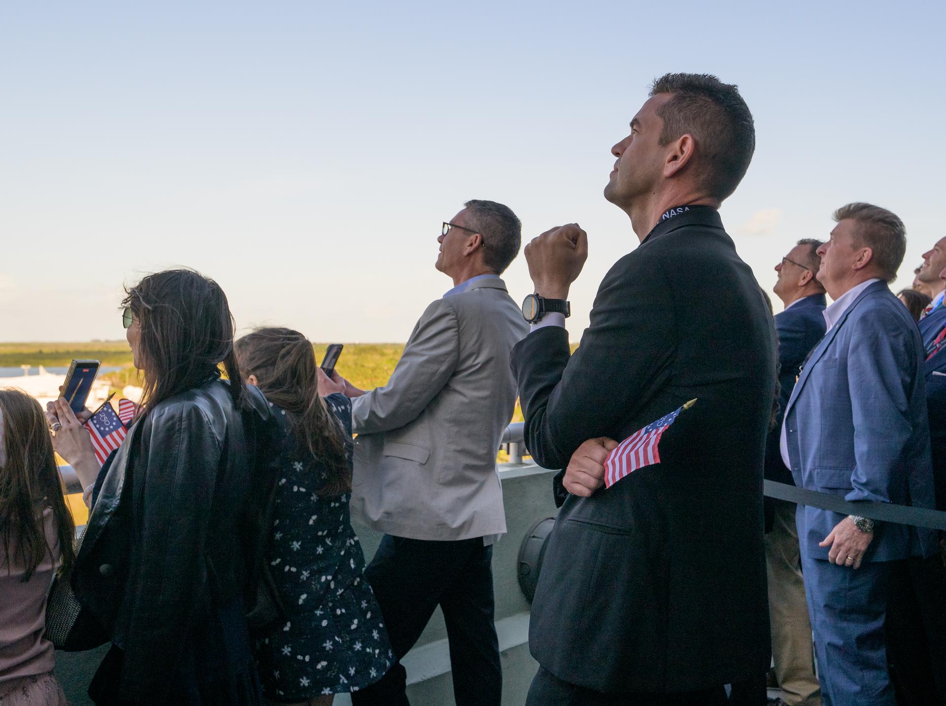 NASA Administrator Jared Isaacman and guests watch the launch of NASA’s Space Launch System rocket carrying the Orion spacecraft with NASA astronauts Reid Wiseman, commander; Victor Glover, pilot; Christina Koch, mission specialist; and CSA (Canadian Space Agency) astronaut Jeremy Hansen, mission specialist on NASA’s Artemis II mission,, Wednesday, April 1, 2026, from Operations and Support Building II at NASA’s Kennedy Space Center in Florida. NASA’s Artemis II mission will take Wiseman, Glover, Koch, and Hansen on a 10-day journey around the Moon and back aboard SLS rocket and Orion spacecraft launched at 6:35pm EDT, from Launch Complex 39B. Photo Credit: (NASA/Bill Ingalls)