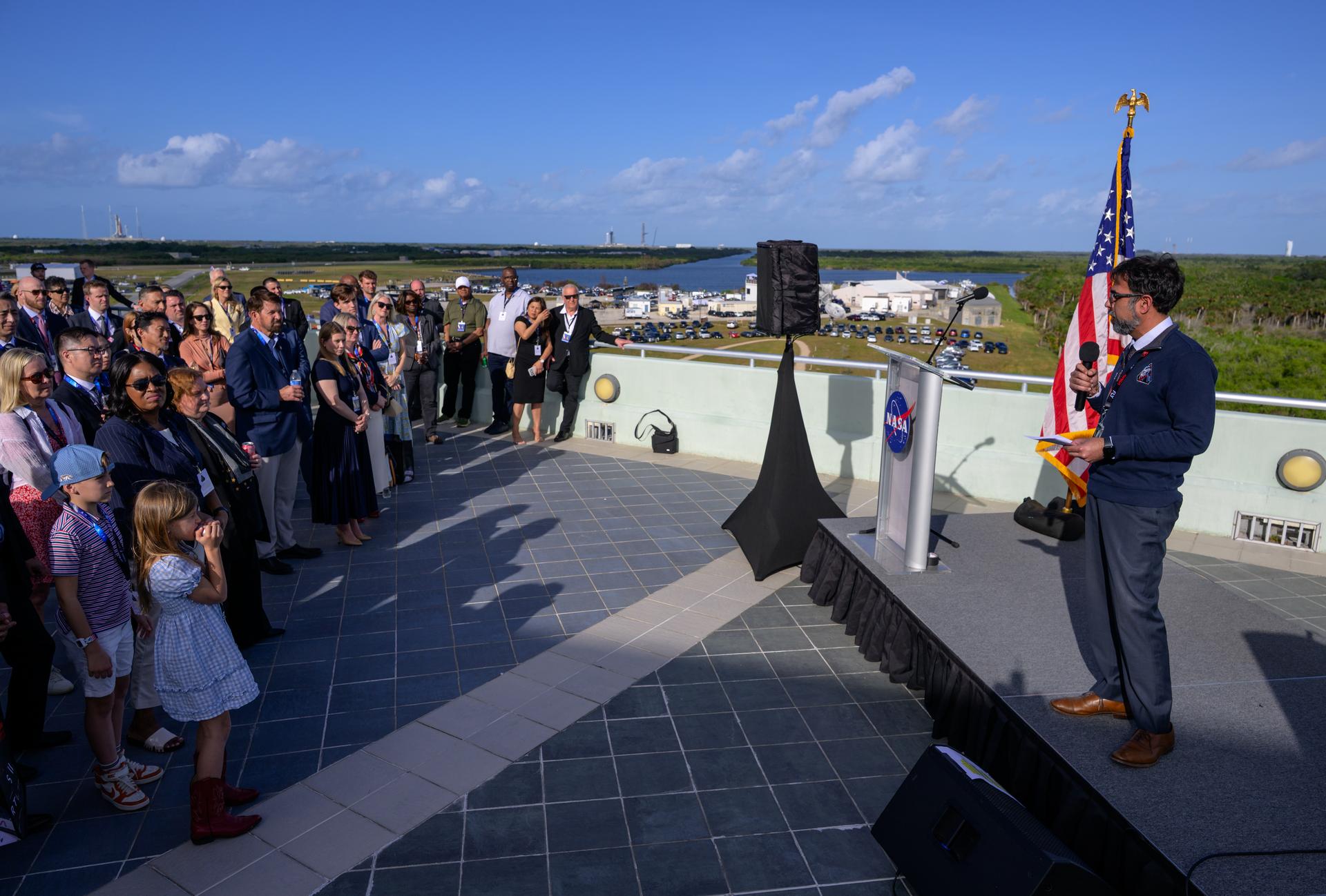 Amit Kshatriya, NASA Associate Administrator gives remarks to guest ahead of the launch of NASA’s Space Launch System rocket carrying the Orion spacecraft with NASA astronauts Reid Wiseman, commander; Victor Glover, pilot; Christina Koch, mission specialist; and CSA (Canadian Space Agency) astronaut Jeremy Hansen, mission specialist on NASA’s Artemis II mission, Wednesday, April 1, 2026, from Operations and Support Building II at NASA’s Kennedy Space Center in Florida. NASA’s Artemis II mission will take Wiseman, Glover, Koch, and Hansen on a 10-day journey around the Moon and back aboard SLS rocket and Orion spacecraft which launched at 6:35pm EDT from Launch Complex 39B. Photo Credit: (NASA/Bill Ingalls)
