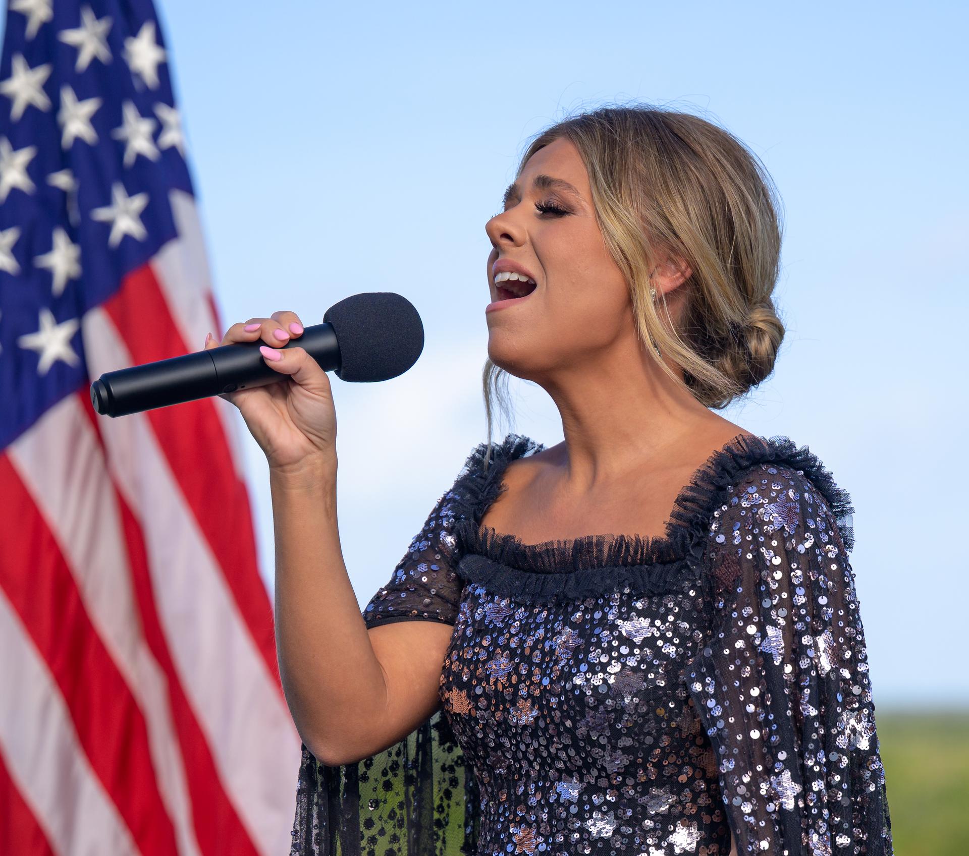 Country artist Anne Wilson sings the national anthem ahead of the launch of NASA’s Space Launch System rocket carrying the Orion spacecraft with NASA astronauts Reid Wiseman, commander; Victor Glover, pilot; Christina Koch, mission specialist; and CSA (Canadian Space Agency) astronaut Jeremy Hansen, mission specialist on NASA’s Artemis II mission, Wednesday, April 1, 2026, from Operations and Support Building II at NASA’s Kennedy Space Center in Florida. NASA’s Artemis II mission will take Wiseman, Glover, Koch, and Hansen on a 10-day journey around the Moon and back aboard SLS rocket and Orion spacecraft which launched at 6:35pm EDT from Launch Complex 39B. Photo Credit: (NASA/Bill Ingalls)