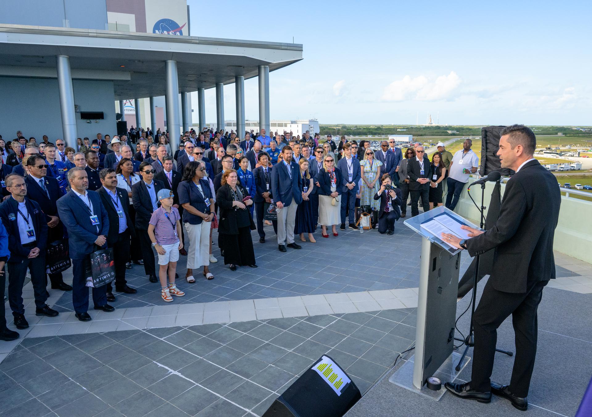 NASA Administrator Jared Isaacman gives remarks to guest ahead of the launch of NASA’s Space Launch System rocket carrying the Orion spacecraft with NASA astronauts Reid Wiseman, commander; Victor Glover, pilot; Christina Koch, mission specialist; and CSA (Canadian Space Agency) astronaut Jeremy Hansen, mission specialist on NASA’s Artemis II mission, Wednesday, April 1, 2026, from Operations and Support Building II at NASA’s Kennedy Space Center in Florida. NASA’s Artemis II mission will take Wiseman, Glover, Koch, and Hansen on a 10-day journey around the Moon and back aboard SLS rocket and Orion spacecraft which launched at 6:35pm EDT from Launch Complex 39B. Photo Credit: (NASA/Bill Ingalls)