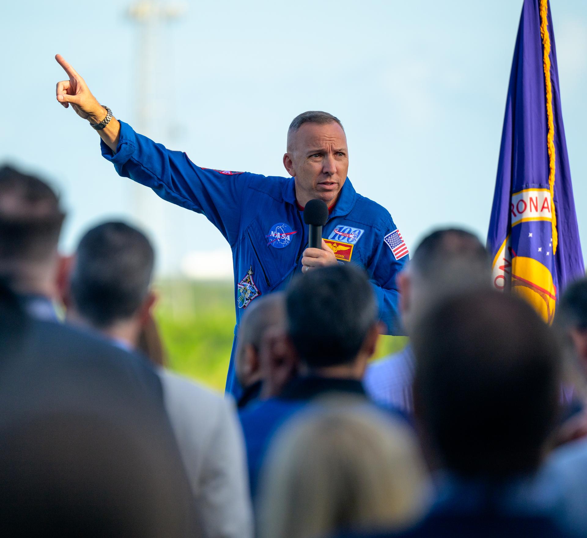 NASA astronaut Randy Bresnik gives remarks to guest ahead of the launch of NASA’s Space Launch System rocket carrying the Orion spacecraft with NASA astronauts Reid Wiseman, commander; Victor Glover, pilot; Christina Koch, mission specialist; and CSA (Canadian Space Agency) astronaut Jeremy Hansen, mission specialist on NASA’s Artemis II mission, Wednesday, April 1, 2026, from Operations and Support Building II at NASA’s Kennedy Space Center in Florida. NASA’s Artemis II mission will take Wiseman, Glover, Koch, and Hansen on a 10-day journey around the Moon and back aboard SLS rocket and Orion spacecraft which launched at 6:35pm EDT from Launch Complex 39B. Photo Credit: (NASA/Bill Ingalls)