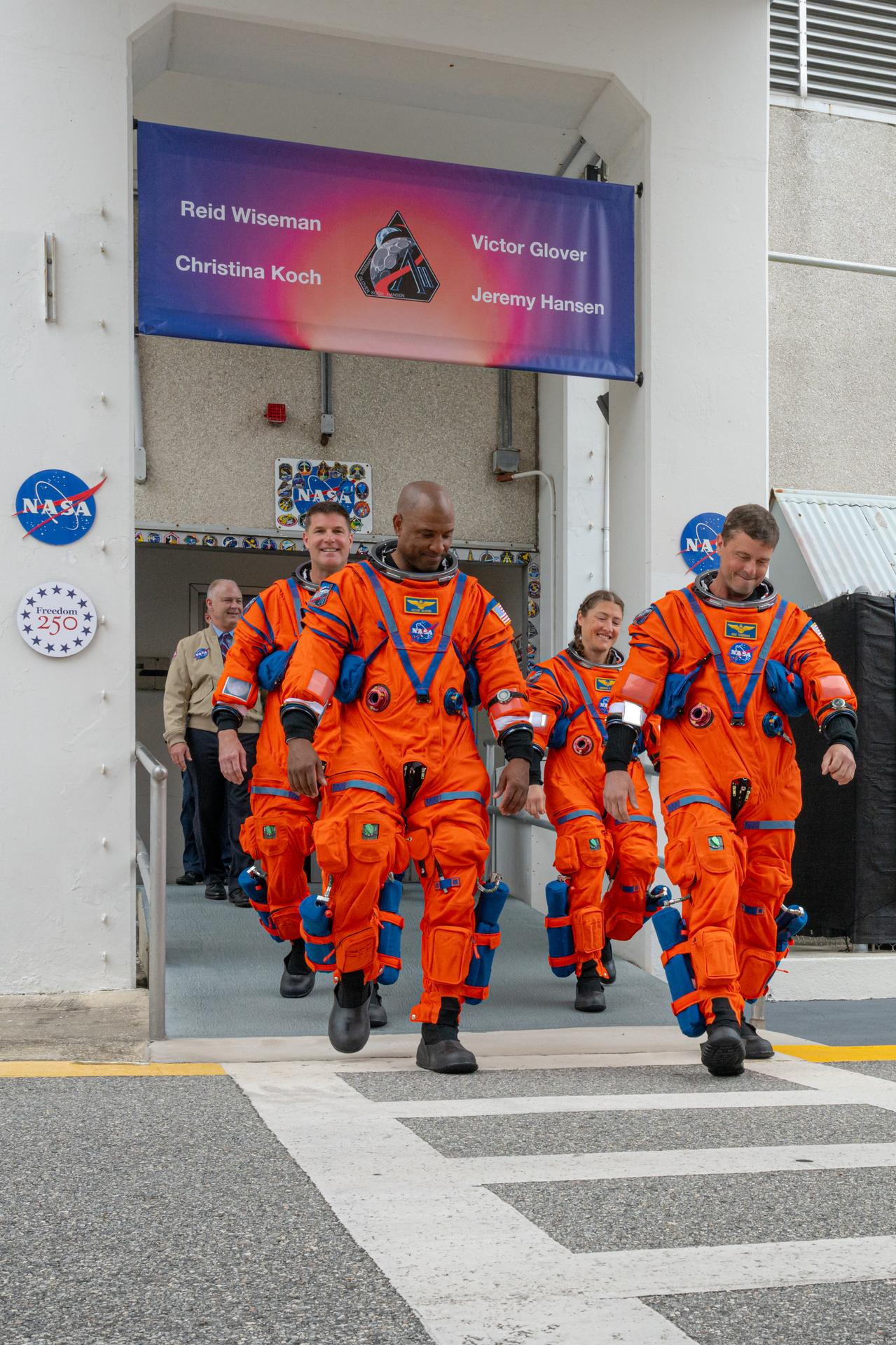 Artemis II astronauts Mission Specialist Jeremy Hansen from the CSA (Canadian Space Agency) and Pilot Victor Glover,  Mission Specialist Christina Koch, and Commander Reid Wiseman from NASA are seen as they prepare to depart the Neil A. Armstrong Operations and Checkout Building for Launch Complex 39B at Kennedy Space Center to board NASA’s Artemis II Space Launch System (SLS) rocket and Orion spacecraft for the Artemis II launch, Wednesday, Apr. 1, 2026, at NASA’s Kennedy Space Center in Florida. NASA’s Artemis II test flight will take Wiseman, Glover, Koch, and Hansen around the Moon and back to Earth no earlier than April 1, 2026. Photo Credit: (NASA/John Kraus)