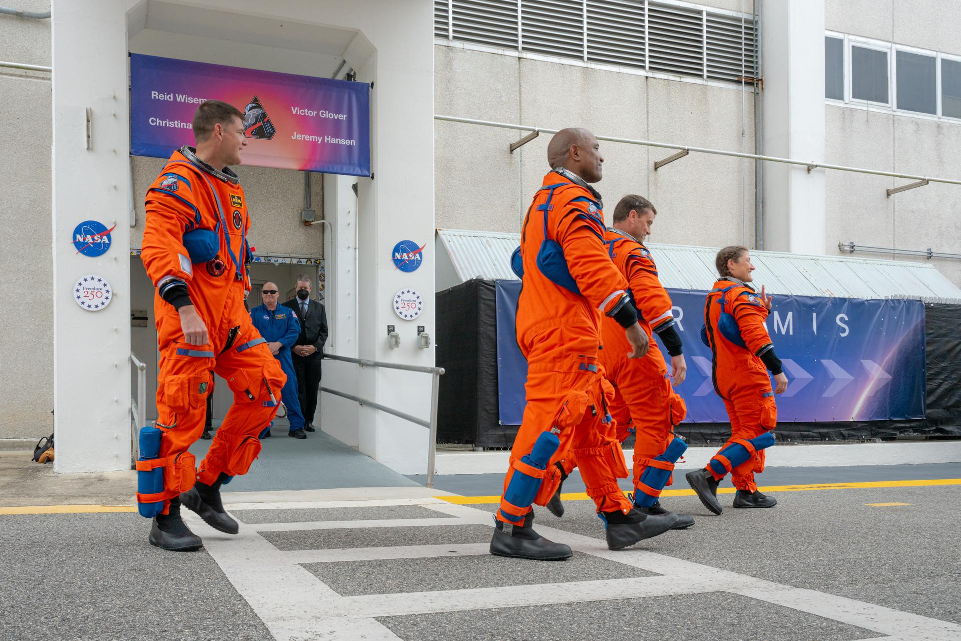 Artemis II astronauts Mission Specialist Jeremy Hansen from the CSA (Canadian Space Agency) and Pilot Victor Glover, Commander Reid Wiseman, and Mission Specialist Christina Koch from NASA are seen as they prepare to depart the Neil A. Armstrong Operations and Checkout Building for Launch Complex 39B at Kennedy Space Center to board NASA’s Artemis II Space Launch System (SLS) rocket and Orion spacecraft for the Artemis II launch, Wednesday, Apr. 1, 2026, at NASA’s Kennedy Space Center in Florida. NASA’s Artemis II test flight will take Wiseman, Glover, Koch, and Hansen around the Moon and back to Earth no earlier than April 1, 2026. Photo Credit: (NASA/John Kraus)