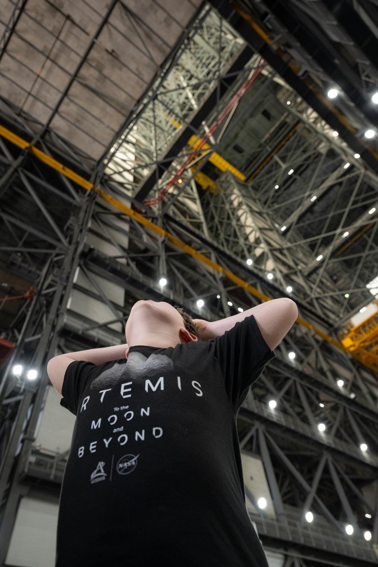 Eleven-year-old Hilt Boling is seen inside NASA’s Vehicle Assembly Building, Friday, Apr. 3, 2026, at NASA’s Kennedy Space Center in Florida. When asked during an April 1 television appearance why he loved space and being at the Artemis II launch, Boling exclaimed: “We’re going back to the freaking Moon, that’s why!” His comments received widespread social media attention in the following days. Photo Credit: (NASA/John Kraus)
