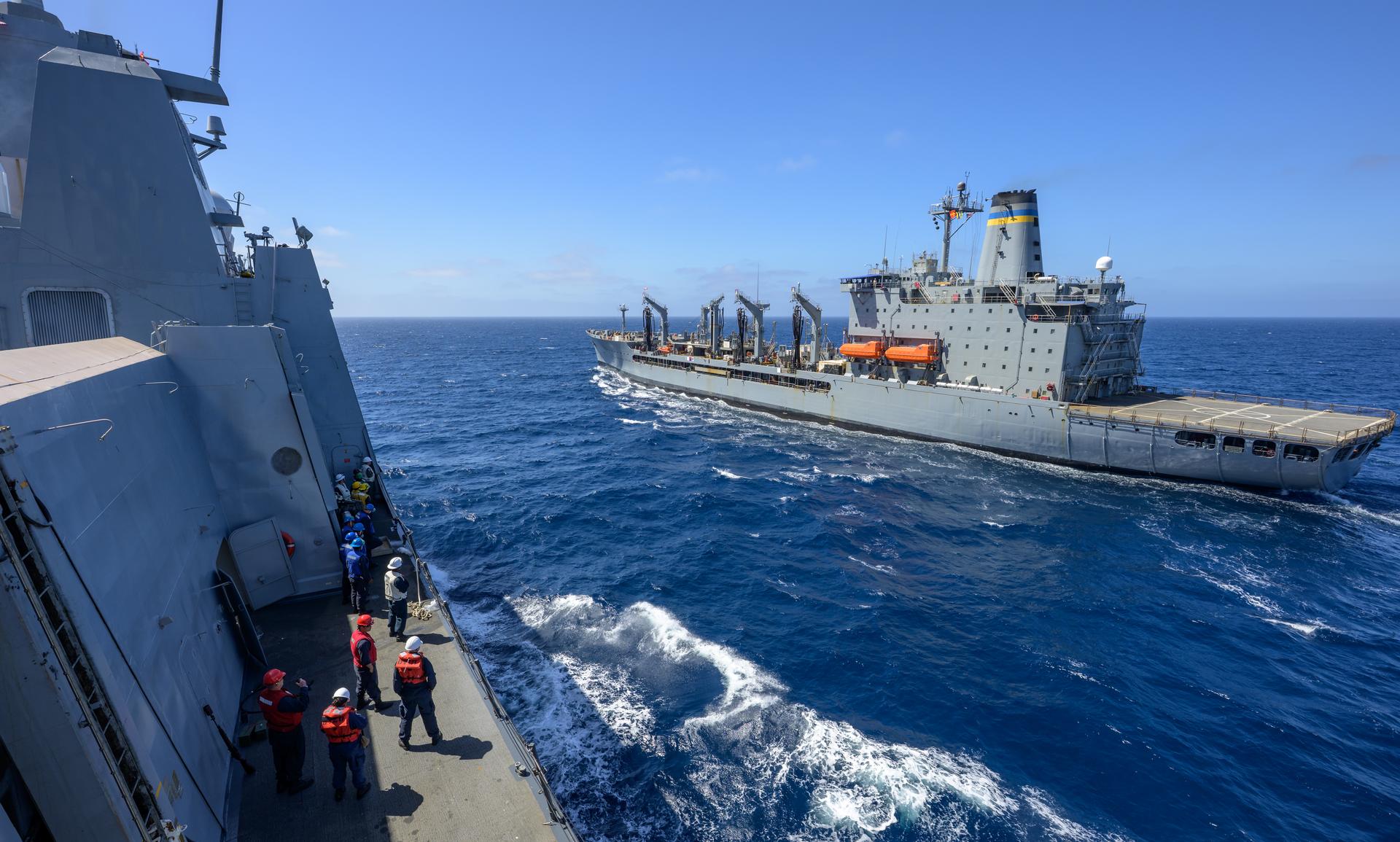 The USNS Guadalupe (T-AO 200) replenishment oiler prepares to refuel USS John P. Murtha (LPD 26) as NASA, U.S. Navy, and U.S. Air Force teams head into the Pacific Ocean for the return of the Artemis II crewmembers to Earth, Monday, April 6, 2026, in the Pacific Ocean off the coast of California. NASA’s Artemis II mission is taking NASA astronauts Reid Wiseman, commander; Victor Glover, pilot; Christina Koch, mission specialist; and CSA (Canadian Space Agency) astronaut Jeremy Hansen, mission specialist on a 10-day journey around the Moon and back aboard their Orion spacecraft. Wiseman, Glover, Koch, and Hansen are scheduled to splash down off the coast of San Diego at approximately 5:07 p.m. PDT (8:07 p.m. EDT) on Friday, April 10.  Photo Credit: (NASA/Bill Ingalls)