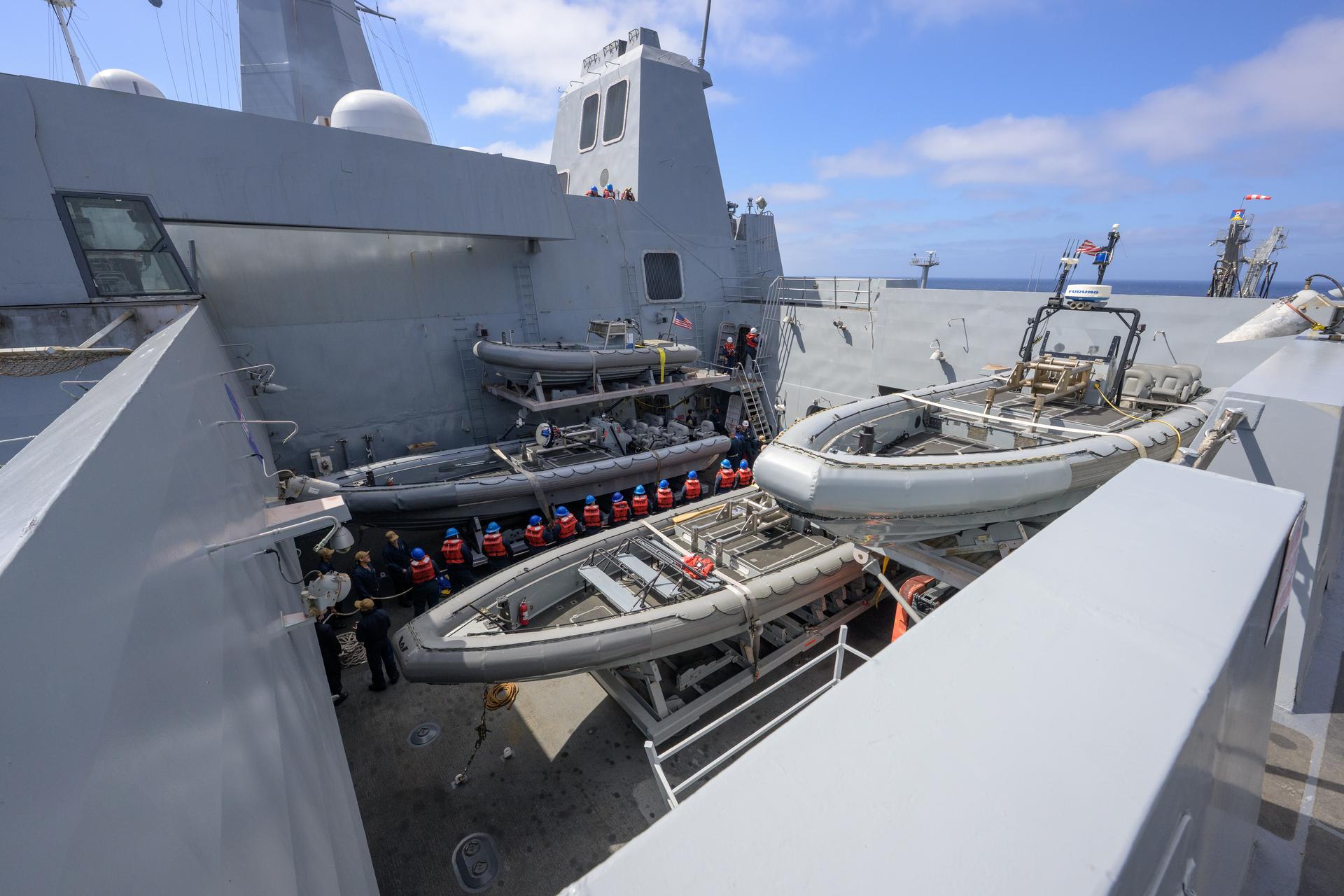 U.S. Navy sailors onboard USS John P. Murtha (LPD 26) pull a tow line from the USNS Guadalupe replenishment ship to refuel at sea, as NASA, U.S. Navy, and U.S. Air Force teams head into the Pacific Ocean for the return of the Artemis II crewmembers to Earth, Monday, April 6, 2026, in the Pacific Ocean off the coast of California. NASA’s Artemis II mission is taking NASA astronauts Reid Wiseman, commander; Victor Glover, pilot; Christina Koch, mission specialist; and CSA (Canadian Space Agency) astronaut Jeremy Hansen, mission specialist on a 10-day journey around the Moon and back aboard their Orion spacecraft. Wiseman, Glover, Koch, and Hansen are scheduled to splash down off the coast of San Diego at approximately 5:07 p.m. PDT (8:07 p.m. EDT) on Friday, April 10.  Photo Credit: (NASA/Bill Ingalls)
