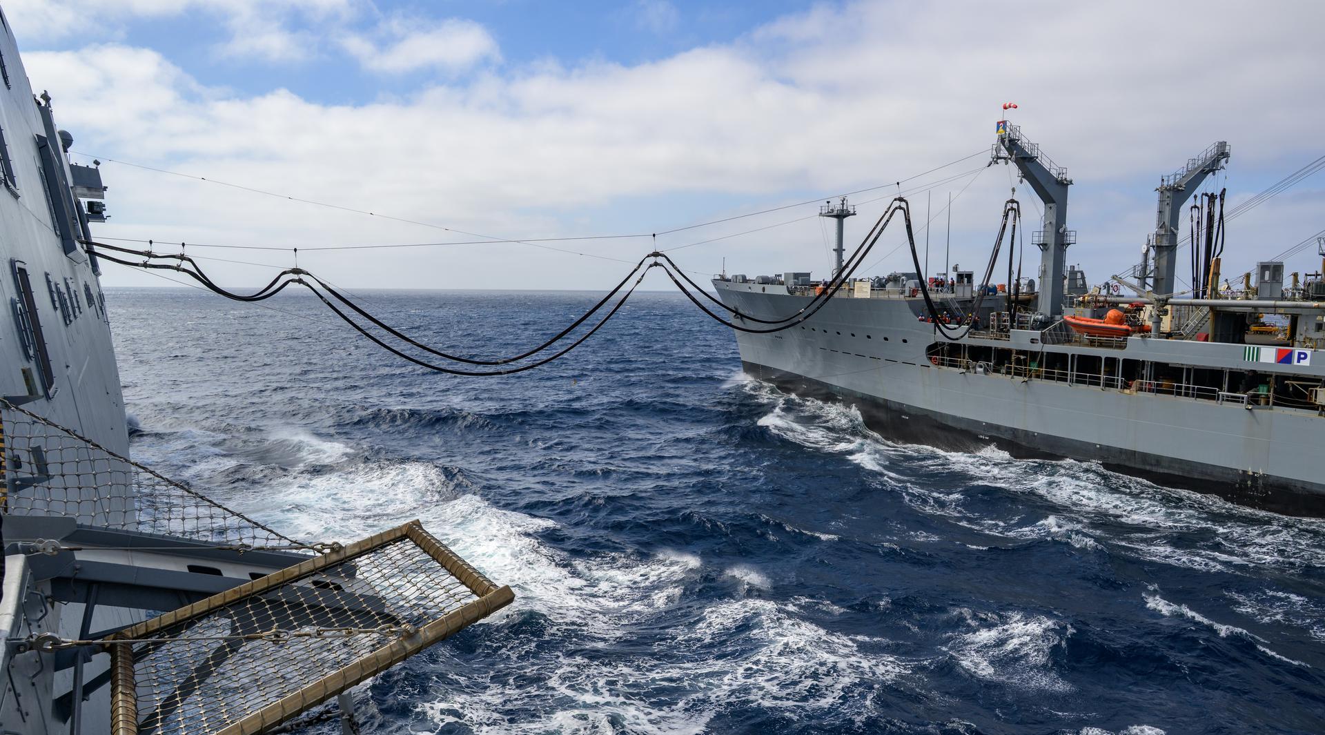 The USNS Guadalupe (T-AO 200) replenishment oiler prepares to refuel USS John P. Murtha (LPD 26) as NASA, U.S. Navy, and U.S. Air Force teams head into the Pacific Ocean for the return of the Artemis II crewmembers to Earth, Monday, April 6, 2026, in the Pacific Ocean off the coast of California. NASA’s Artemis II mission is taking NASA astronauts Reid Wiseman, commander; Victor Glover, pilot; Christina Koch, mission specialist; and CSA (Canadian Space Agency) astronaut Jeremy Hansen, mission specialist on a 10-day journey around the Moon and back aboard their Orion spacecraft. Wiseman, Glover, Koch, and Hansen are scheduled to splash down off the coast of San Diego at approximately 5:07 p.m. PDT (8:07 p.m. EDT) on Friday, April 10.  Photo Credit: (NASA/Bill Ingalls)