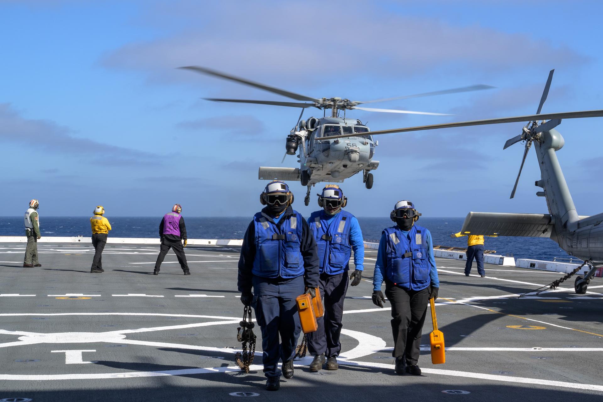 U.S. Navy MH-60 Seahawks from Helicopter Sea Combat Squadron (HSC) 23 depart USS John P. Murtha as they conduct air operations training as NASA, U.S. Navy, and U.S. Air Force teams prepare for the the return of the Artemis II crewmembers to Earth, Tuesday, April 7, 2026, in the Pacific Ocean off the coast of California. NASA’s Artemis II mission is taking NASA astronauts Reid Wiseman, commander; Victor Glover, pilot; Christina Koch, mission specialist; and CSA (Canadian Space Agency) astronaut Jeremy Hansen, mission specialist on a 10-day journey around the Moon and back aboard their Orion spacecraft. Wiseman, Glover, Koch, and Hansen are scheduled to splash down off the coast of San Diego at approximately 5:07 p.m. PDT (8:07 p.m. EDT) on Friday, April 10.  Photo Credit: (NASA/Bill Ingalls)