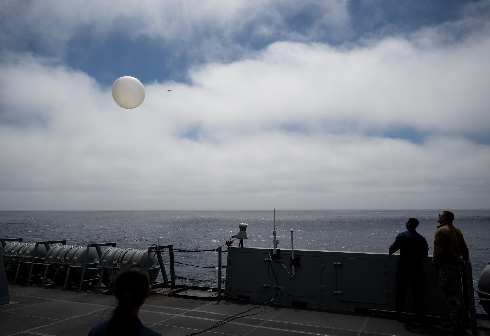 A Sailor onboard USS John P. Murtha assists in launching a weather balloon for the 45th Weather Squadron as NASA, U.S. Navy, and U.S. Air Force teams continue to prepare for the the return of the Artemis II crewmembers to Earth, Wednesday, April 8, 2026, onboard USS John P. Murtha in the Pacific Ocean off the coast of California. NASA’s Artemis II mission is taking NASA astronauts Reid Wiseman, commander; Victor Glover, pilot; Christina Koch, mission specialist; and CSA (Canadian Space Agency) astronaut Jeremy Hansen, mission specialist on a 10-day journey around the Moon and back aboard their Orion spacecraft. Wiseman, Glover, Koch, and Hansen are scheduled to splash down off the coast of San Diego at approximately 5:07 p.m. PDT (8:07 p.m. EDT) on Friday, April 10.  Photo Credit: (NASA/Joel Kowsky)