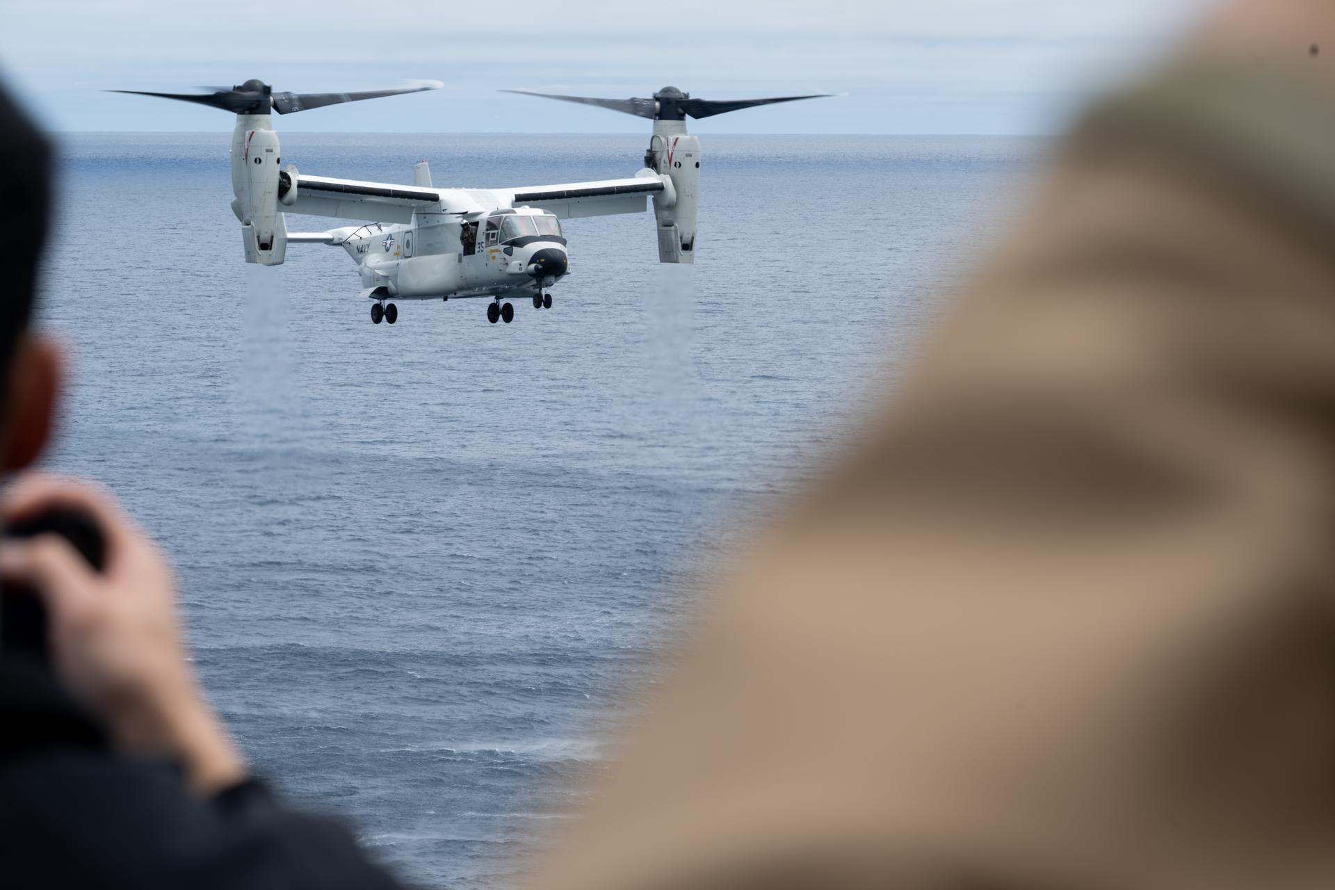 A U.S. Navy CMV-22 Osprey is seen as it approaches the flight deck of USS John P. Murtha with NASA Administrator Jared Isaacman, U.S. Navy Rear Adm. Brent DeVore, Commander, Expeditionary Strike Group Three, and U.S. Air Force Maj. Gen. Michael A. Valle, Deputy Commander, First Air Force, as NASA and U.S. military teams prepare for the the return of the Artemis II crewmembers to Earth, Friday, April 10, 2026, in the Pacific Ocean off the coast of California. NASA’s Artemis II mission is taking NASA astronauts Reid Wiseman, commander; Victor Glover, pilot; Christina Koch, mission specialist; and CSA (Canadian Space Agency) astronaut Jeremy Hansen, mission specialist on a 10-day journey around the Moon and back aboard their Orion spacecraft. Wiseman, Glover, Koch, and Hansen are scheduled to splash down off the coast of San Diego at approximately 5:07 p.m. PDT (8:07 p.m. EDT). Photo Credit: (NASA/Joel Kowsky)