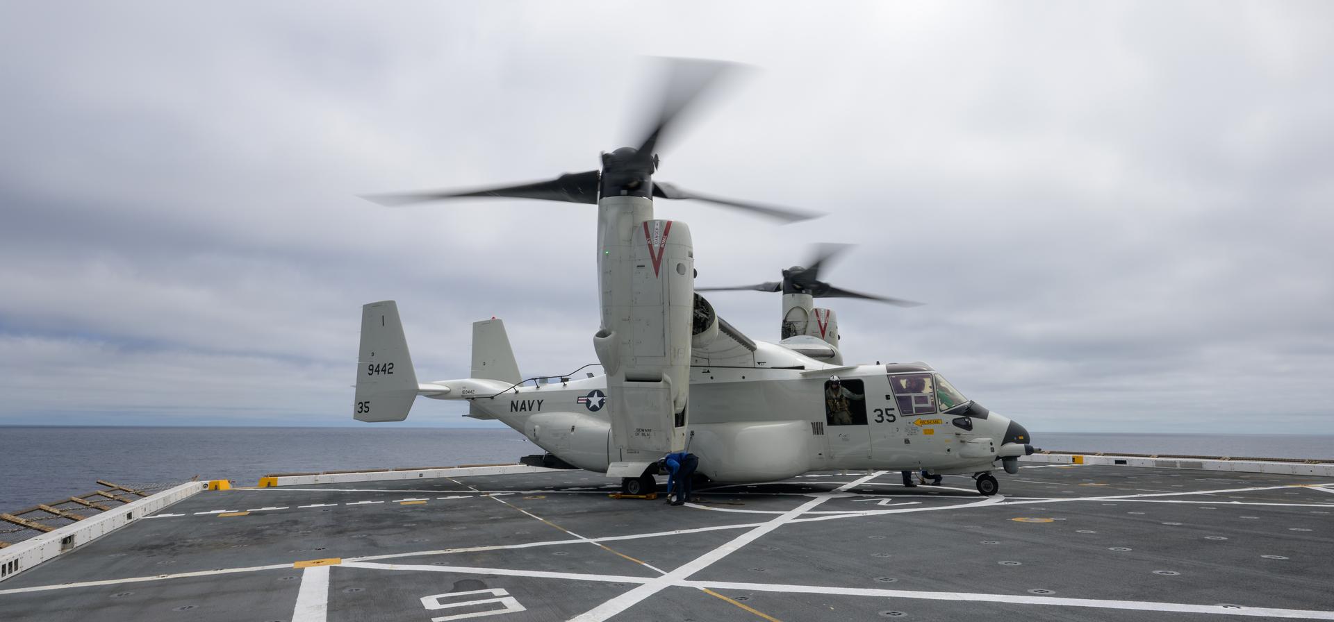 A U.S. Navy CMV-22 Osprey lands on the flight deck of USS John P. Murtha with NASA Administrator Jared Isaacman, Michael Altenhofen, senior advisor to the NASA Administrator, U.S. Navy Rear Adm. Brent DeVore, Commander, Expeditionary Strike Group Three, and U.S. Air Force Maj. Gen. Michael A. Valle, Deputy Commander, First Air Force, as NASA and U.S. military teams prepare for the the return of the Artemis II crewmembers to Earth, Friday, April 10, 2026, in the Pacific Ocean off the coast of California. NASA’s Artemis II mission is taking NASA astronauts Reid Wiseman, commander; Victor Glover, pilot; Christina Koch, mission specialist; and CSA (Canadian Space Agency) astronaut Jeremy Hansen, mission specialist on a 10-day journey around the Moon and back aboard their Orion spacecraft. Wiseman, Glover, Koch, and Hansen are scheduled to splash down off the coast of San Diego at approximately 5:07 p.m. PDT (8:07 p.m. EDT). Photo Credit: (NASA/Bill Ingalls)