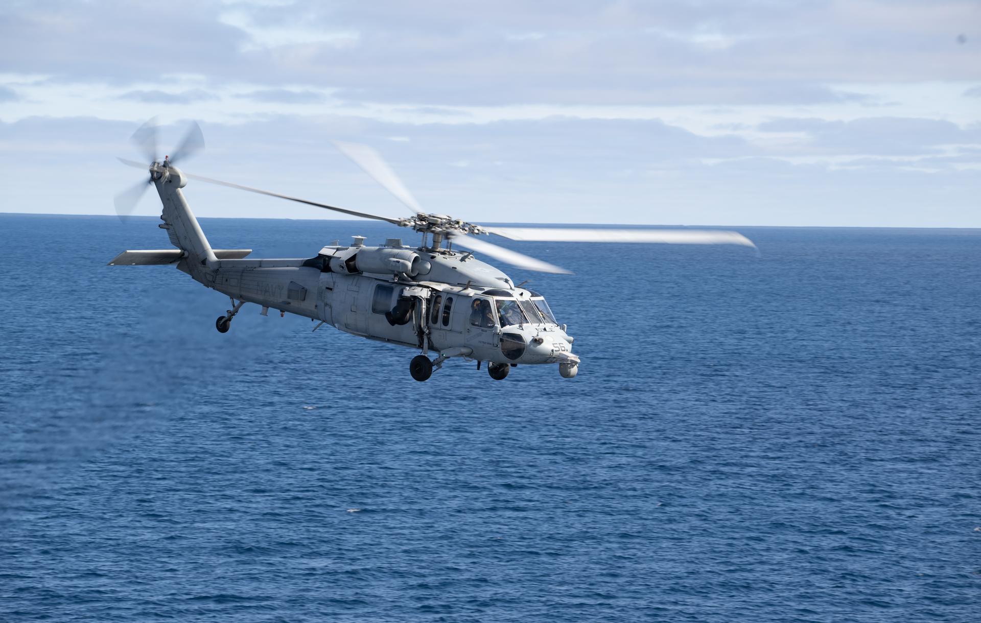 A U.S. Navy MH-60 Seahawk from Helicopter Sea Combat Squadron (HSC) 23 departs from the flight deck of USS John P. Murtha as NASA and U.S. military teams deploy in preparation for the the return of the Artemis II crewmembers to Earth, Friday, April 10, 2026, in the Pacific Ocean off the coast of California. NASA’s Artemis II mission is taking NASA astronauts Reid Wiseman, commander; Victor Glover, pilot; Christina Koch, mission specialist; and CSA (Canadian Space Agency) astronaut Jeremy Hansen, mission specialist on a 10-day journey around the Moon and back aboard their Orion spacecraft. Wiseman, Glover, Koch, and Hansen are scheduled to splash down off the coast of San Diego at approximately 5:07 p.m. PDT (8:07 p.m. EDT).  Photo Credit: (NASA/Joel Kowsky)