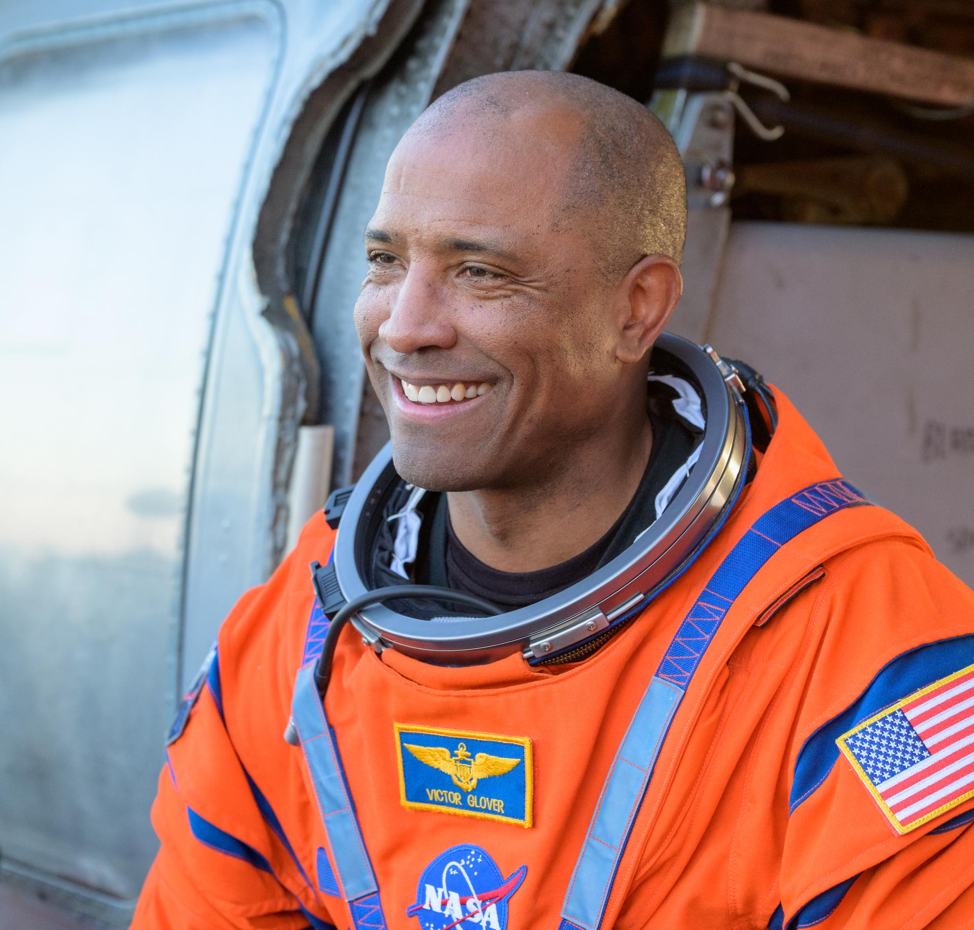 NASA astronaut Victor Glover, Artemis II pilot is seen sitting in a Navy MH-60 Seahawk from Helicopter Sea Combat Squadron (HSC) 23 on the flight deck of USS John P. Murtha after he and fellow crewmates NASA Astronauts Reid Wiseman,  Christina Koch, and CSA (Canadian Space Agency) astronaut Jeremy Hansen, Artemis II mission specialist were extracted from their Orion spacecraft after splashdown, Friday, April 10, 2026, in the Pacific Ocean off the coast of California. NASA’s Artemis II mission took the quartet on a nearly 10-day journey around the Moon and back to Earth. Following a splashdown at 5:07 p.m. PDT (8:07 p.m. EDT), NASA, U.S. Navy, and U.S. Air Force teams are working to bring the Orion spacecraft aboard the recovery ship. Photo Credit: (NASA/Bill Ingalls)
