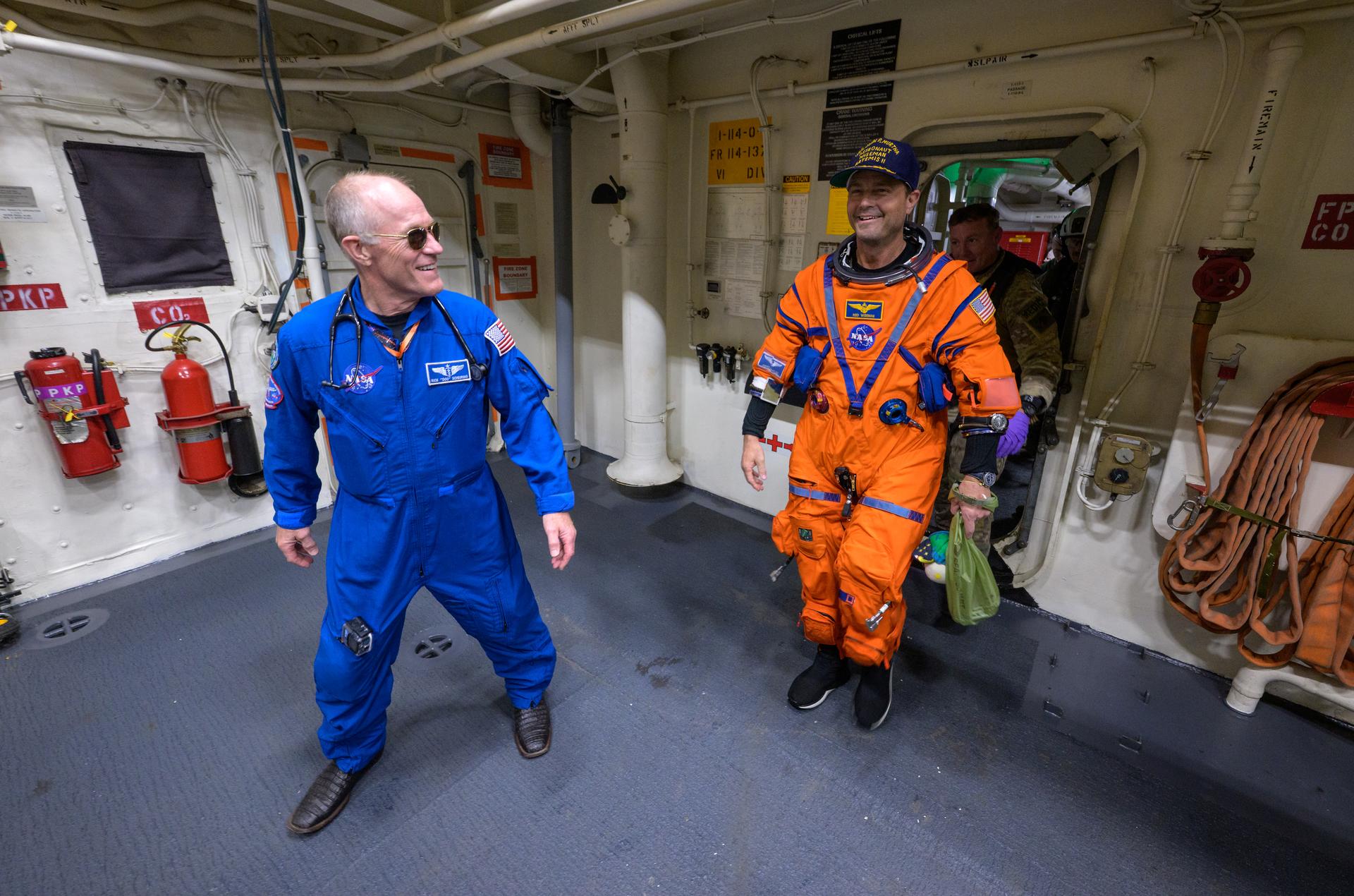 NASA astronaut Reid Wiseman, Artemis II commander is assisted off the flight deck after arriving aboard USS John P. Murtha after he and fellow crewmates NASA Astronauts Victor Glover, Christina Koch, and CSA (Canadian Space Agency) astronaut Jeremy Hansen, were extracted from their Orion spacecraft after splashdown, Friday, April 10, 2026, in the Pacific Ocean off the coast of California. NASA’s Artemis II mission took the quartet on a 10-day journey around the Moon and back to Earth. Following a splashdown at , NASA and U.S. military teams are working to bring the crewmembers and Orion spacecraft aboard the recovery ship. Photo Credit: (NASA/Bill Ingalls)
