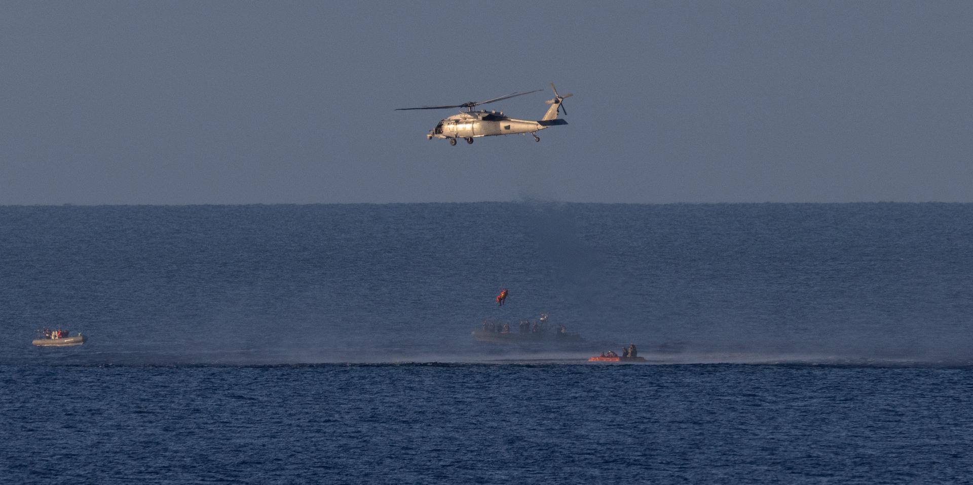 A Navy MH-60 Seahawk from Helicopter Sea Combat Squadron (HSC) 23 is seen as it lifts NASA astronaut Christina Koch, Artemis II mission specialist as teams work to bring the crewmembers aboard USS John P. Murtha, Friday, April 10,  2026, in the Pacific Ocean off the coast of California. NASA’s Artemis II mission took Koch, NASA astronauts Reid Wiseman, commander; Victor Glover, pilot; and CSA (Canadian Space Agency) astronaut Jeremy Hansen, mission specialist on a nearly 10-day journey around the Moon and back to Earth. Following a splashdown at 5:07 p.m. PDT (8:07 p.m. EDT), NASA, U.S. Navy, and U.S. Air Force teams are working to bring the crewmembers and Orion spacecraft aboard the recovery ship. Photo Credit: (NASA/Joel Kowsky)