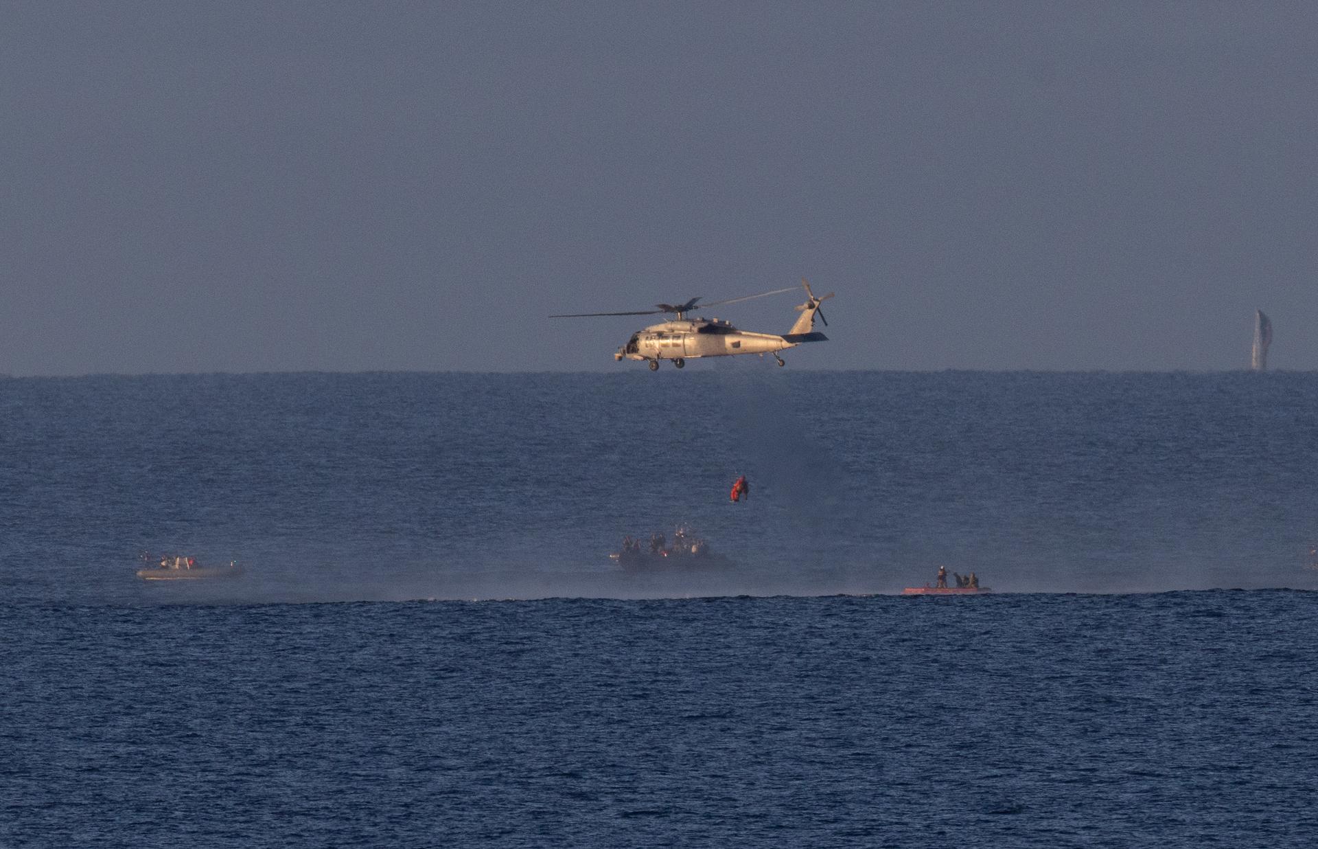 A Navy MH-60 Seahawk from Helicopter Sea Combat Squadron (HSC) 23 is seen as it lifts NASA astronaut Victor Glover, Artemis II pilot as teams work to bring the crewmembers aboard USS John P. Murtha, Friday, April 10, 2026, in the Pacific Ocean off the coast of California. NASA’s Artemis II mission took Glover, NASA astronauts Reid Wiseman, commander; Christina Koch, mission specialist; and CSA (Canadian Space Agency) astronaut Jeremy Hansen, mission specialist on a nearly 10-day journey around the Moon and back to Earth. Following a splashdown at 5:07 p.m. PDT (8:07 p.m. EDT), NASA, U.S. Navy, and U.S. Air Force teams are working to bring the crewmembers and Orion spacecraft aboard the recovery ship. Photo Credit: (NASA/Joel Kowsky)