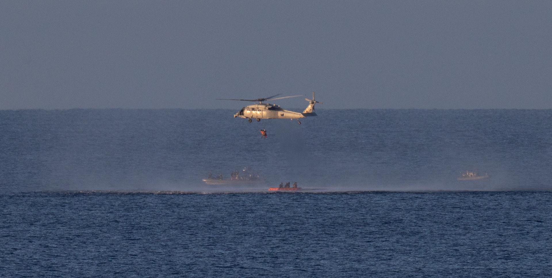 A Navy MH-60 Seahawk from Helicopter Sea Combat Squadron (HSC) 23 is seen as it lifts NASA astronaut Reid Wiseman, Artemis II commander as teams work to bring the crewmembers aboard USS John P. Murtha, Friday, April 10, 2026, in the Pacific Ocean off the coast of California. NASA’s Artemis II mission took Wiseman, NASA astronauts Victor Glover, pilot; Christina Koch, mission specialist; and CSA (Canadian Space Agency) astronaut Jeremy Hansen, mission specialist on a nearly 10-day journey around the Moon and back to Earth. Following a splashdown at 5:07 p.m. PDT (8:07 p.m. EDT), NASA, U.S. Navy, and U.S. Air Force teams are working to bring the crewmembers and Orion spacecraft aboard the recovery ship. Photo Credit: (NASA/Joel Kowsky)