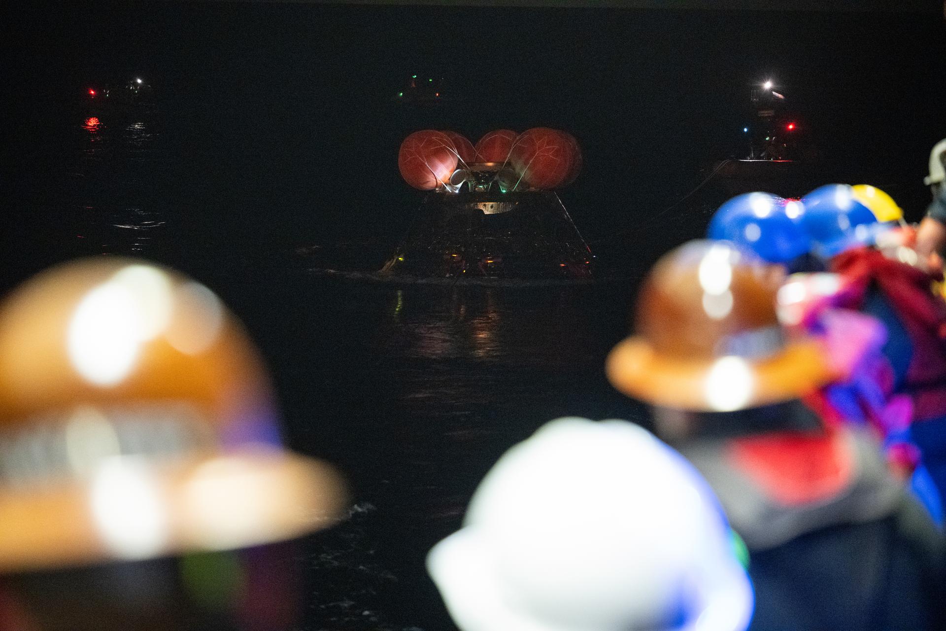 NASA’s Orion spacecraft is seen as the agency’s Landing and Recovery team, along with U.S. Navy personnel work to recover the spacecraft into the well deck of USS John P. Murtha in the Pacific Ocean off the coast of California, Friday, April 10, 2026. NASA’s Artemis II mission, which took NASA astronauts Reid Wiseman, commander; Victor Glover, pilot; Christina Koch, mission specialist; and CSA (Canadian Space Agency) astronaut Jeremy Hansen, mission specialist on a nearly 10-day journey around the Moon and back to Earth, splashed down at 5:07 p.m. PDT (8:07 p.m. EDT).  Photo Credit: (NASA/Joel Kowsky)