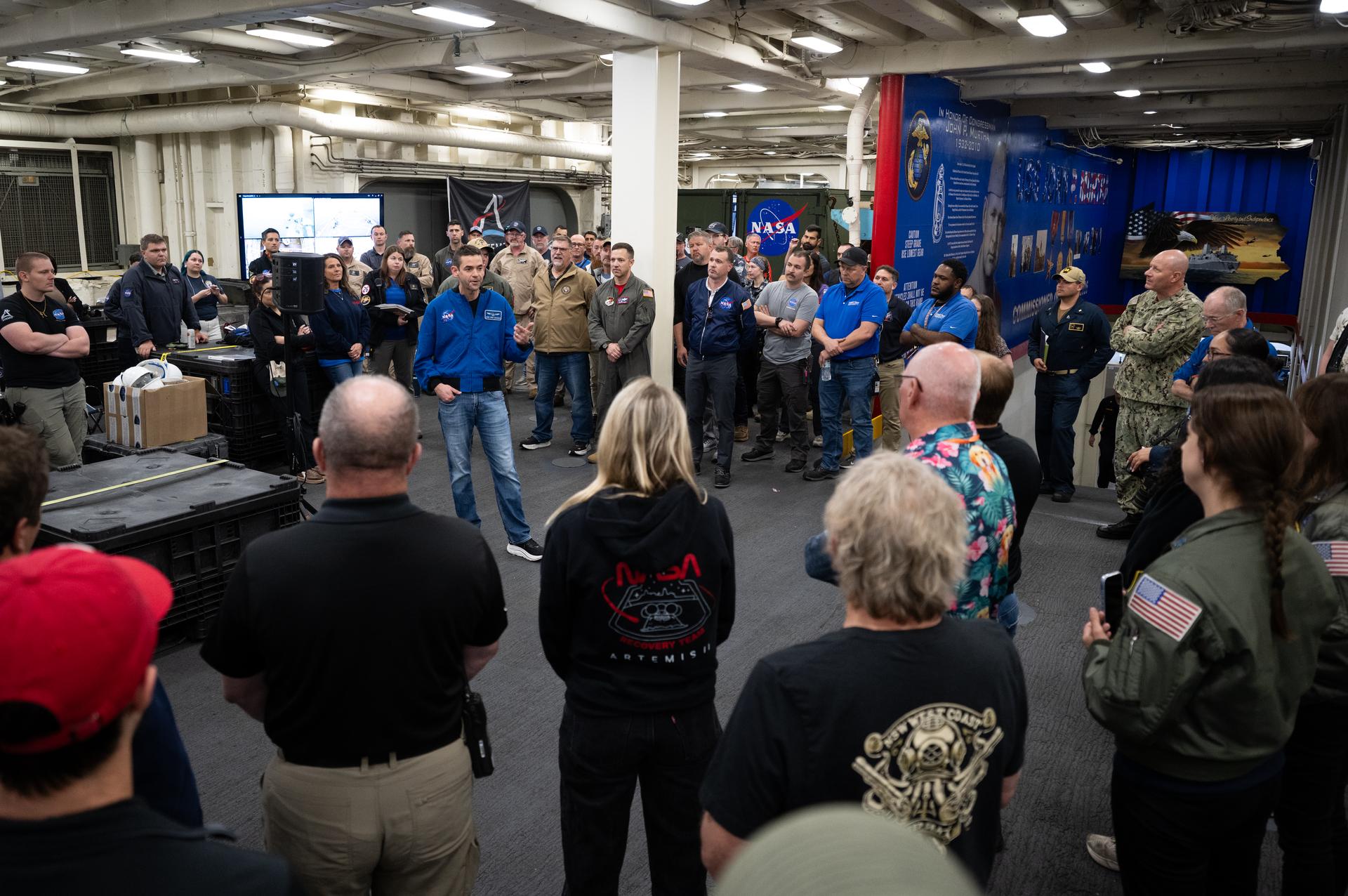 NASA Administrator Jared Isaacman speaks to NASA and U.S. military recovery team members onboard USS John P. Murtha as they prepare for the return of NASA’s Orion spacecraft with Artemis II crewmembers NASA astronauts Reid Wiseman, commander; Victor Glover, pilot; Christina Koch, mission specialist; and CSA (Canadian Space Agency) astronaut Jeremy Hansen, mission specialist aboard in the Pacific Ocean off the coast of California, Friday, April 10, 2026. NASA’s Artemis II mission took Wiseman, Glover, Koch, and Hansen on a nearly 10-day journey around the Moon and back to Earth. The quartet splashed down in the Pacific Ocean at 5:07 p.m. PDT (8:07 p.m. EDT). Photo Credit: (NASA/Joel Kowsky)
