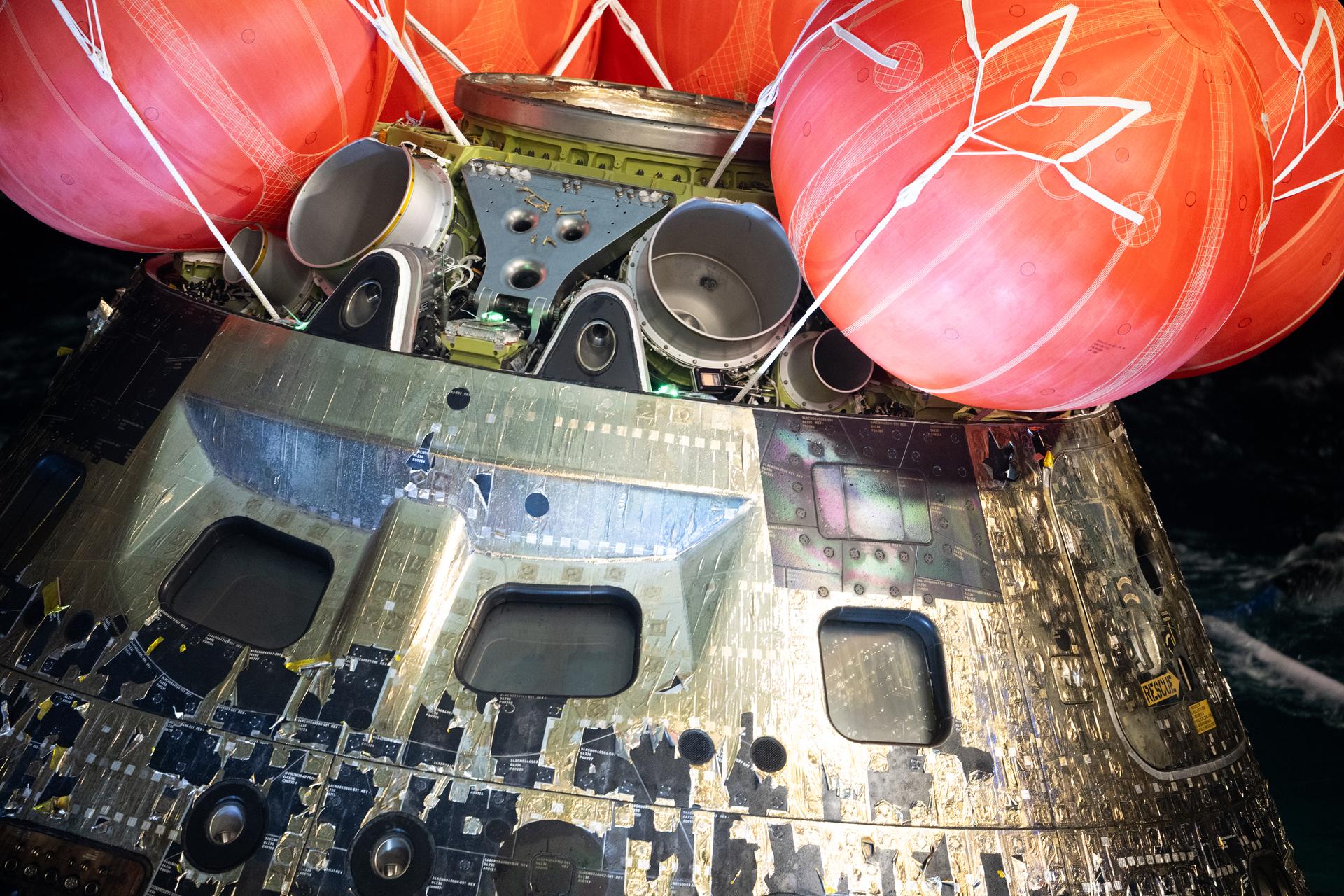 NASA’s Orion spacecraft is seen as the agency’s Landing and Recovery team, along with U.S. Navy personnel work to recover the spacecraft into the well deck of USS John P. Murtha in the Pacific Ocean off the coast of California, Saturday, April 11, 2026. NASA’s Artemis II mission, which took NASA astronauts Reid Wiseman, commander; Victor Glover, pilot; Christina Koch, mission specialist; and CSA (Canadian Space Agency) astronaut Jeremy Hansen, mission specialist on a nearly 10-day journey around the Moon and back to Earth, splashed down at 5:07 p.m. PDT (8:07 p.m. EDT).  Photo Credit: (NASA/Joel Kowsky)