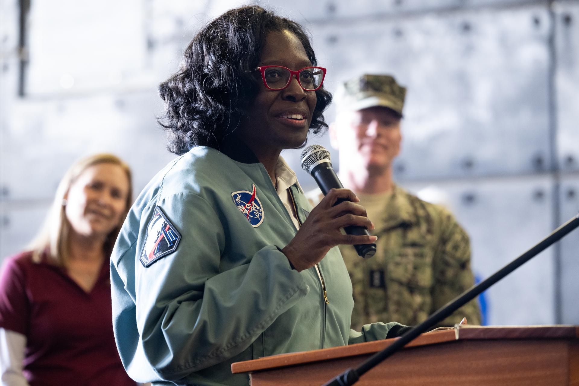 Lakiesha Hawkins, acting deputy associate administrator for NASA's Exploration Systems Development Mission Directorate, speaks to the crew of USS John P. Murtha, NASA Landing and Recovery teams, and the agency’s U.S. military recovery partners in the well deck of John P. Murtha, Saturday, April 11, 2026, at Naval Base San Diego after supporting recovery operations for NASA’s Artemis II mission. The agency’s Artemis II mission, which took NASA astronauts Reid Wiseman, commander; Victor Glover, pilot; Christina Koch, mission specialist; and CSA (Canadian Space Agency) astronaut Jeremy Hansen, mission specialist on a nearly 10-day journey around the Moon and back to Earth, splashed down at 5:07 p.m. PDT (8:07 p.m. EDT) on April 10 in the Pacific Ocean off the coast of California.  Photo Credit: (NASA/Joel Kowsky)