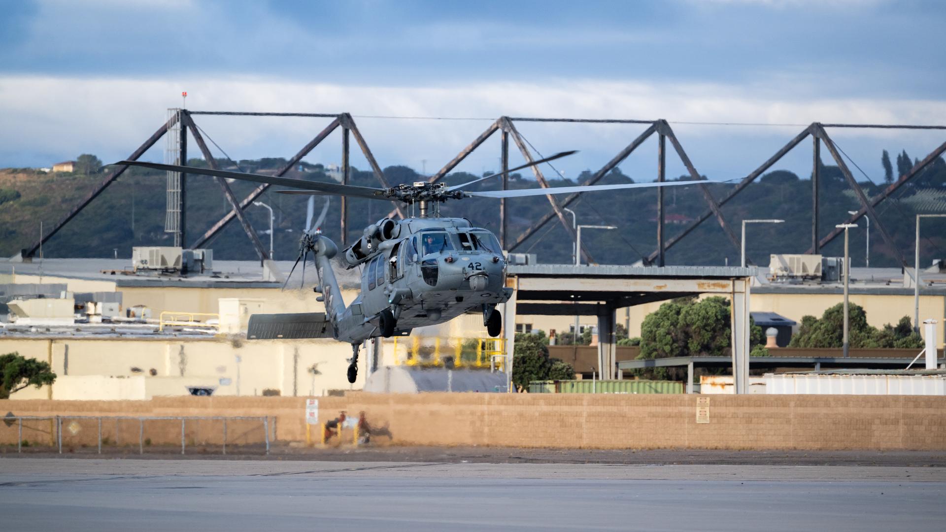 Navy MH-60 Seahawks from Helicopter Sea Combat Squadron (HSC) 23 are seen as they arrive at Naval Air Station North Island, Calif. after flying from USS John P. Murtha with Artemis II NASA astronauts Reid Wiseman, commander; Victor Glover, pilot; Christina Koch, mission specialist; and CSA (Canadian Space Agency) astronaut Jeremy Hansen, mission specialist onboard, Saturday, April 11, 2026, following a splashdown in the Pacific Ocean off the coast of California at 5:07 p.m. PDT (8:07 p.m. EDT) on April 10. NASA’s Artemis II mission took the quartet on a nearly ten day journey around the Moon and back to Earth. Photo Credit: (NASA/Keegan Barber)