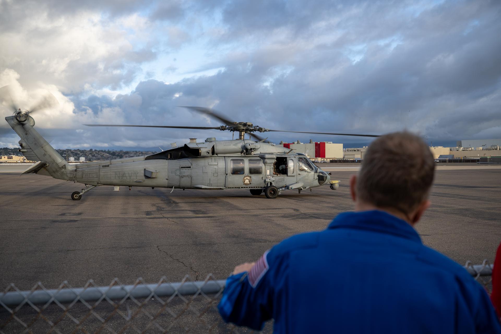 Navy MH-60 Seahawks from Helicopter Sea Combat Squadron (HSC) 23 are seen as they arrive at Naval Air Station North Island, Calif. after flying from USS John P. Murtha with Artemis II NASA astronauts Reid Wiseman, commander; Victor Glover, pilot; Christina Koch, mission specialist; and CSA (Canadian Space Agency) astronaut Jeremy Hansen, mission specialist onboard, Saturday, April 11, 2026, following a splashdown in the Pacific Ocean off the coast of California at 5:07 p.m. PDT (8:07 p.m. EDT) on April 10. NASA’s Artemis II mission took the quartet on a nearly ten day journey around the Moon and back to Earth. Photo Credit: (NASA/Keegan Barber)