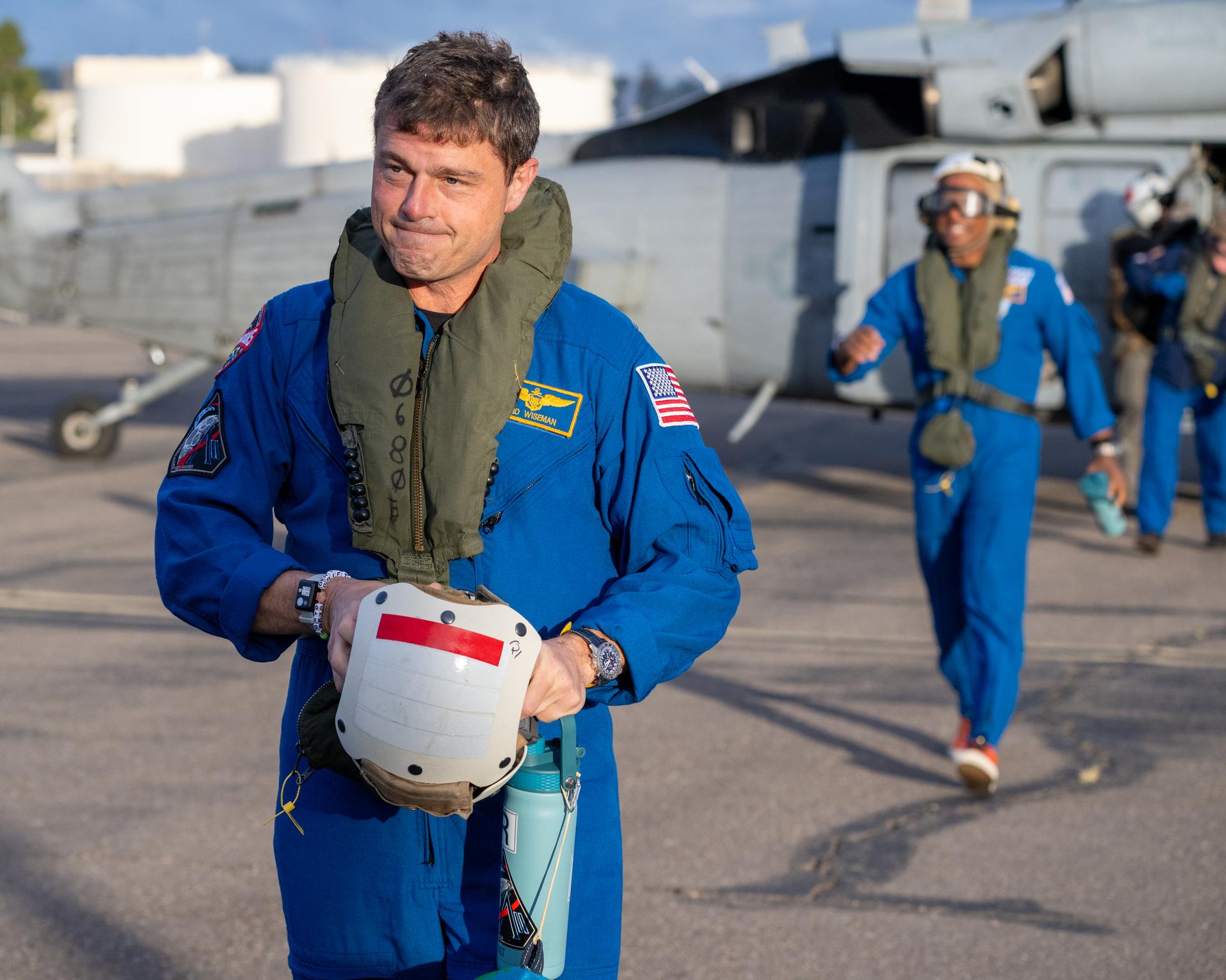 Artemis II NASA astronaut Reid Wiseman, commander, and Victor Glover, pilot, are seen after being flown from USS John P. Murtha to Naval Air Station North Island on Navy MH-60 Seahawks from Helicopter Sea Combat Squadron (HSC) 23, Saturday, April 11, 2026, following a splashdown in the Pacific Ocean off the coast of California at 5:07 p.m. PDT (8:07 p.m. EDT) on April 10. NASA’s Artemis II mission took NASA astronauts Reid Wiseman, commander; Victor Glover, pilot; Christina Koch, mission specialist; and CSA (Canadian Space Agency) astronaut Jeremy Hansen, mission specialist on a nearly ten day journey around the Moon and back to Earth. Photo Credit: (NASA/Keegan Barber)