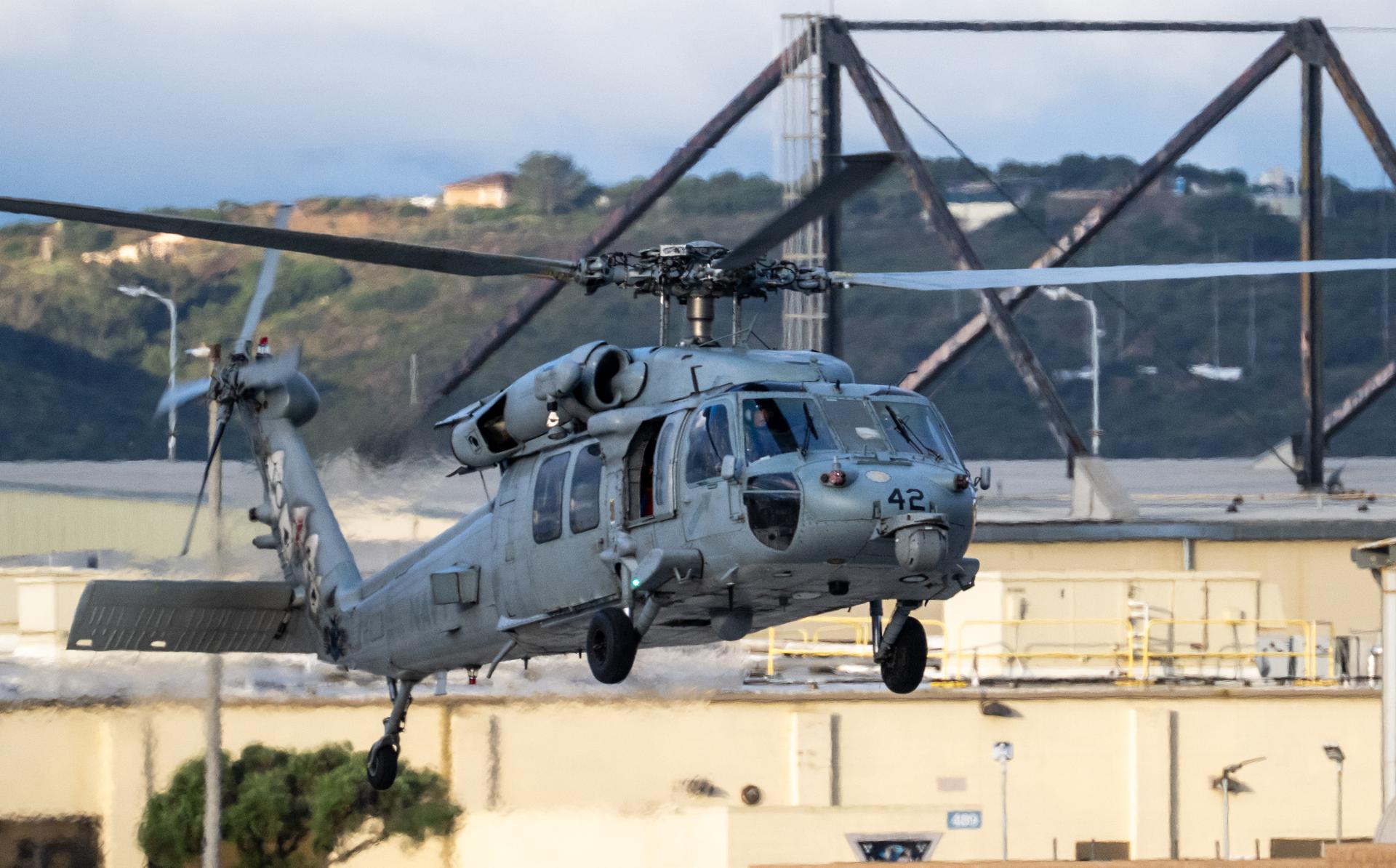 Navy MH-60 Seahawks from Helicopter Sea Combat Squadron (HSC) 23 are seen as they arrive at Naval Air Station North Island, Calif. after flying from USS John P. Murtha with Artemis II NASA astronauts Reid Wiseman, commander; Victor Glover, pilot; Christina Koch, mission specialist; and CSA (Canadian Space Agency) astronaut Jeremy Hansen, mission specialist onboard, Saturday, April 11, 2026, following a splashdown in the Pacific Ocean off the coast of California at 5:07 p.m. PDT (8:07 p.m. EDT) on April 10. NASA’s Artemis II mission took the quartet on a nearly ten day journey around the Moon and back to Earth. Photo Credit: (NASA/Keegan Barber)