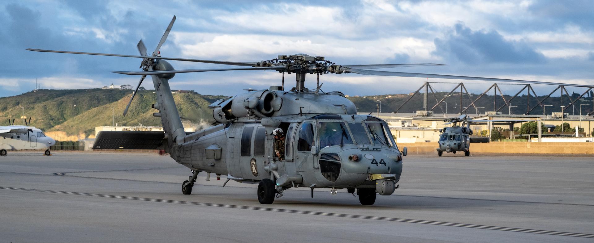 Navy MH-60 Seahawks from Helicopter Sea Combat Squadron (HSC) 23 are seen as they arrive at Naval Air Station North Island, Calif. after flying from USS John P. Murtha with Artemis II NASA astronauts Reid Wiseman, commander; Victor Glover, pilot; Christina Koch, mission specialist; and CSA (Canadian Space Agency) astronaut Jeremy Hansen, mission specialist onboard, Saturday, April 11, 2026, following a splashdown in the Pacific Ocean off the coast of California at 5:07 p.m. PDT (8:07 p.m. EDT) on April 10. NASA’s Artemis II mission took the quartet on a nearly ten day journey around the Moon and back to Earth. Photo Credit: (NASA/Keegan Barber)