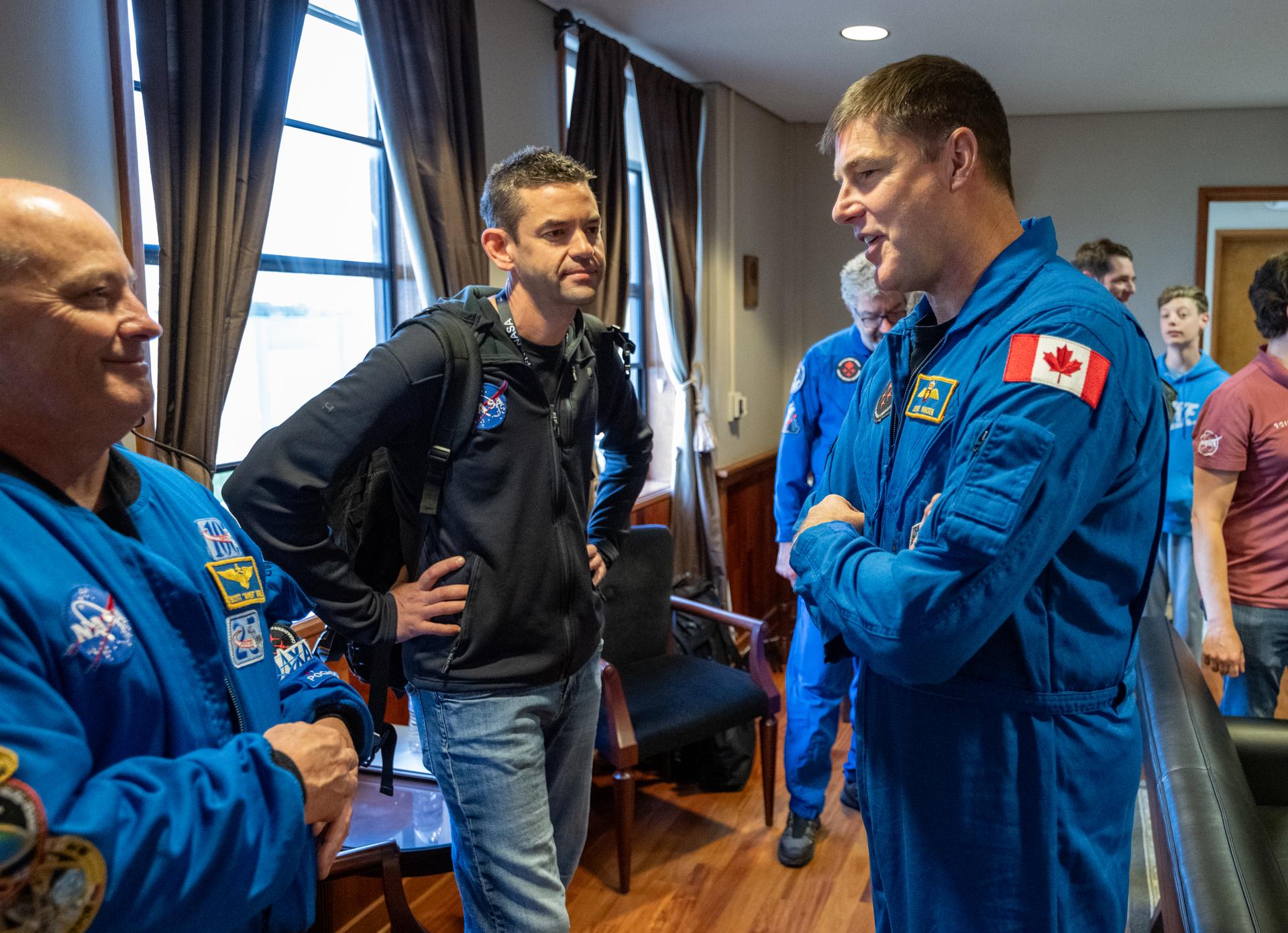 From left to right, Chief of the Astronaut Office Scott Tingle, NASA Administrator Jared Isaacman, and CSA (Canadian Space Agency) astronaut Jeremy Hansen are seen at Naval Air Station North Island, Saturday, April 11, 2026, following a splashdown in the Pacific Ocean off the coast of California at 5:07 p.m. PDT (8:07 p.m. EDT) on April 10. NASA’s Artemis II mission took NASA astronauts Reid Wiseman, commander; Victor Glover, pilot; Christina Koch, mission specialist; and CSA (Canadian Space Agency) astronaut Jeremy Hansen, mission specialist on a nearly ten day journey around the Moon and back to Earth. Photo Credit: (NASA/Keegan Barber)
