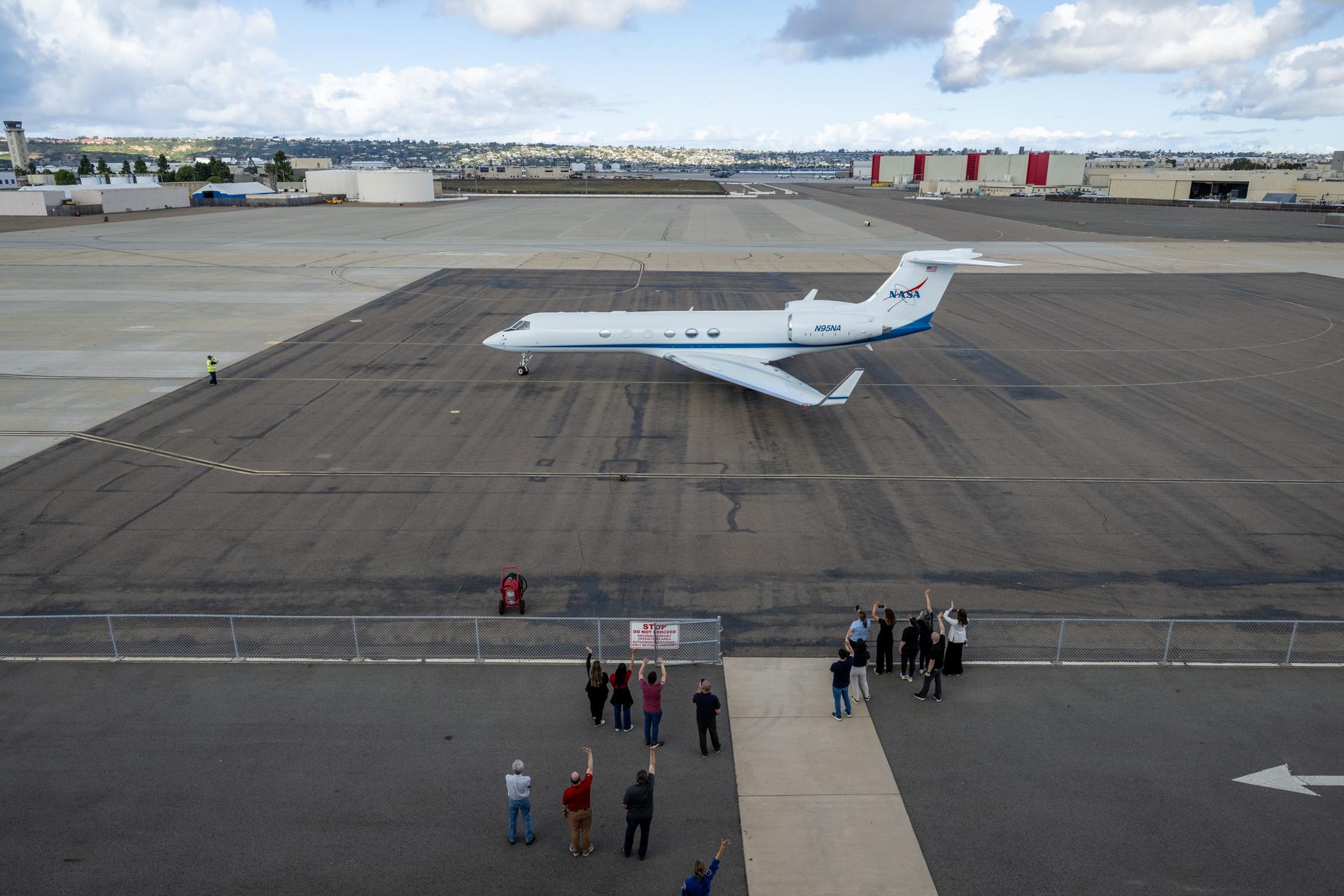 The NASA Gulfstream V carrying NASA astronauts Reid Wiseman, commander; Victor Glover, pilot; Christina Koch, mission specialist; and CSA (Canadian Space Agency) astronaut Jeremy Hansen, mission specialist is seen as it prepares for takeoff Saturday, April 11, 2026, at Naval Air Station North Island in San Diego, Calif. NASA’s Artemis II mission took the quartet on a nearly ten day journey around the Moon and back to Earth. Photo Credit: (NASA/Keegan Barber)