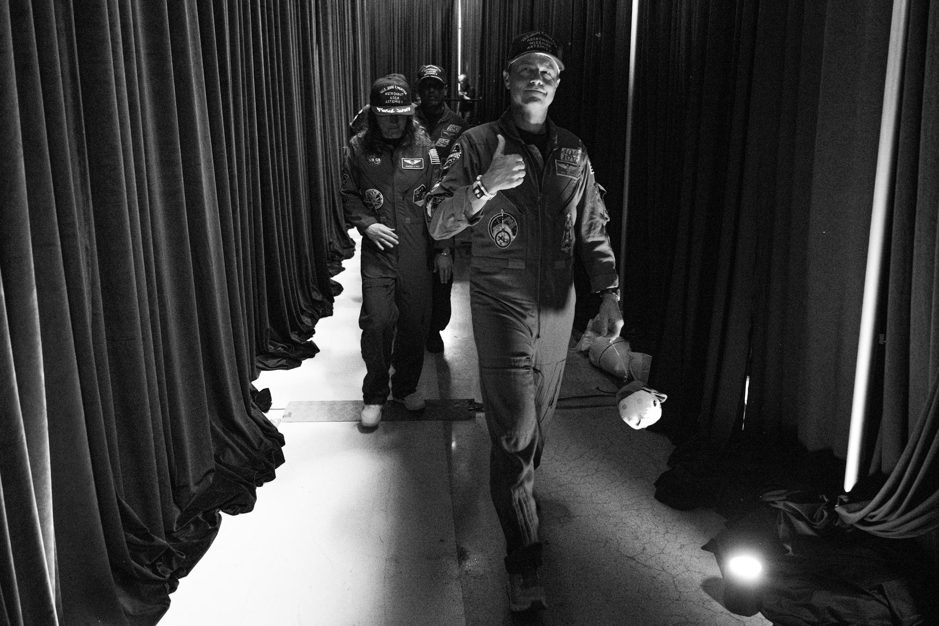 NASA astronaut Reid Wiseman, Artemis II commander, gives a thumbs up as the Artemis II crew arrives backstage during a crew return event, Saturday, Apr. 11, 2026, at Ellington Field in Houston, Texas. NASA’s Artemis II test flight took Commander Reid Wiseman, Pilot Victor Glover, and Mission Specialist Christina Koch from NASA, and Mission Specialist Jeremy Hansen from the CSA (Canadian Space Agency) on an approximately nine-day mission around the Moon and back to Earth. Photo Credit: (NASA/John Kraus)