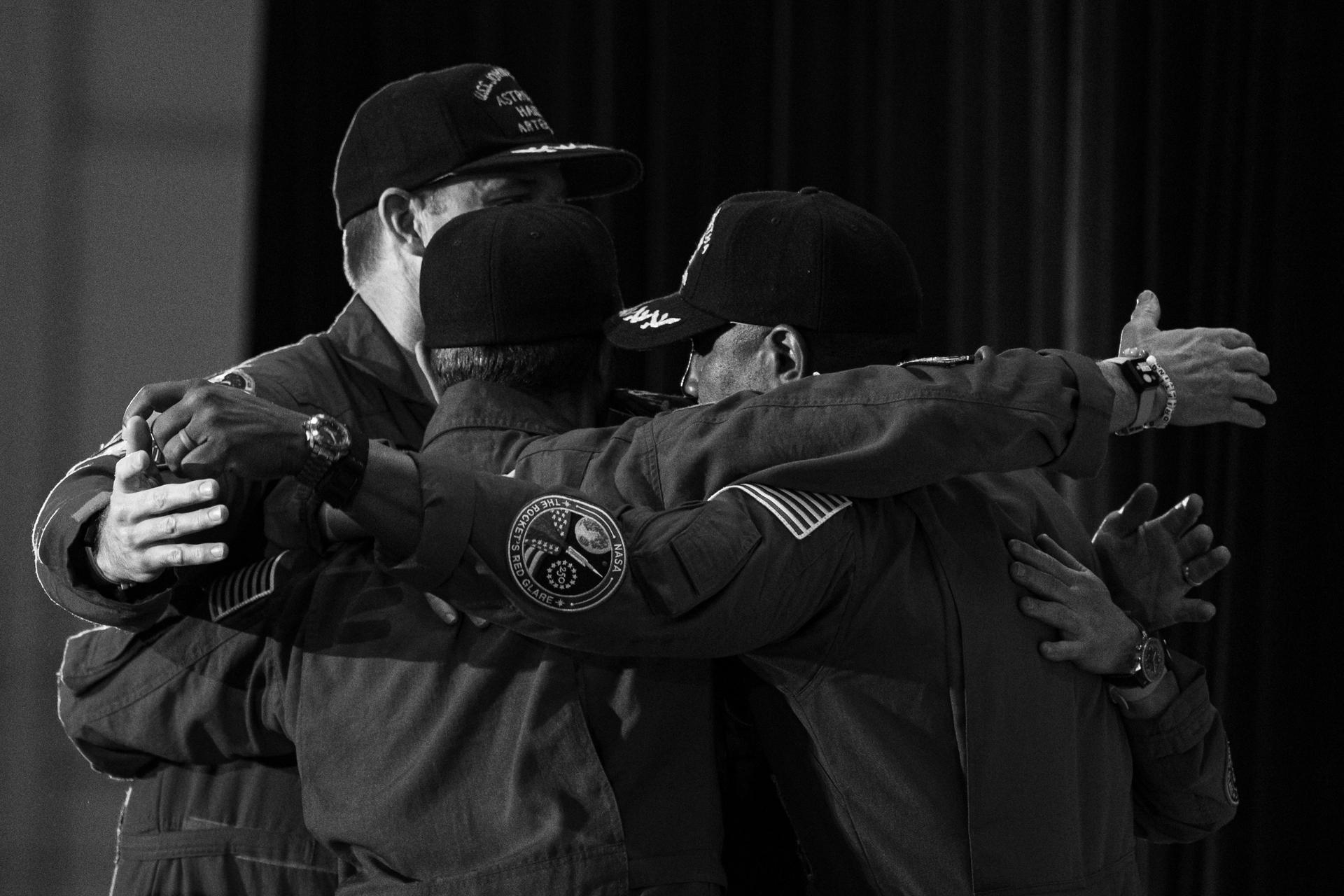 The Artemis II crew of Commander Reid Wiseman, Pilot Victor Glover, Mission Specialist Christina Koch from NASA and Mission Specialist Jeremy Hansen from the CSA (Canadian Space Agency) embrace during a crew return event, Saturday, Apr. 11, 2026, at Ellington Field in Houston, Texas. NASA’s Artemis II test flight took Commander Reid Wiseman, Pilot Victor Glover, and Mission Specialist Christina Koch from NASA, and Mission Specialist Jeremy Hansen from the CSA (Canadian Space Agency) on an approximately nine-day mission around the Moon and back to Earth. Photo Credit: (NASA/John Kraus)