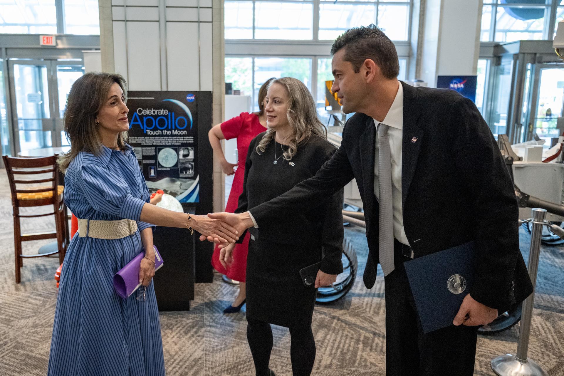 NASA Administrator Jared Isaacman, right, greets Ambassador of Jordan to the United States Dina Kawar, left, prior to an Artemis Accords signing ceremony Thursday, April 23, 2026, at the Mary W. Jackson NASA Headquarters building in Washington. The Hashemite Kingdom of Jordan is the 63rd country to sign the Artemis Accords, which establish a practical set of principles to guide space exploration cooperation among nations participating in NASA’s Artemis program. Photo Credit: (NASA/Keegan Barber)