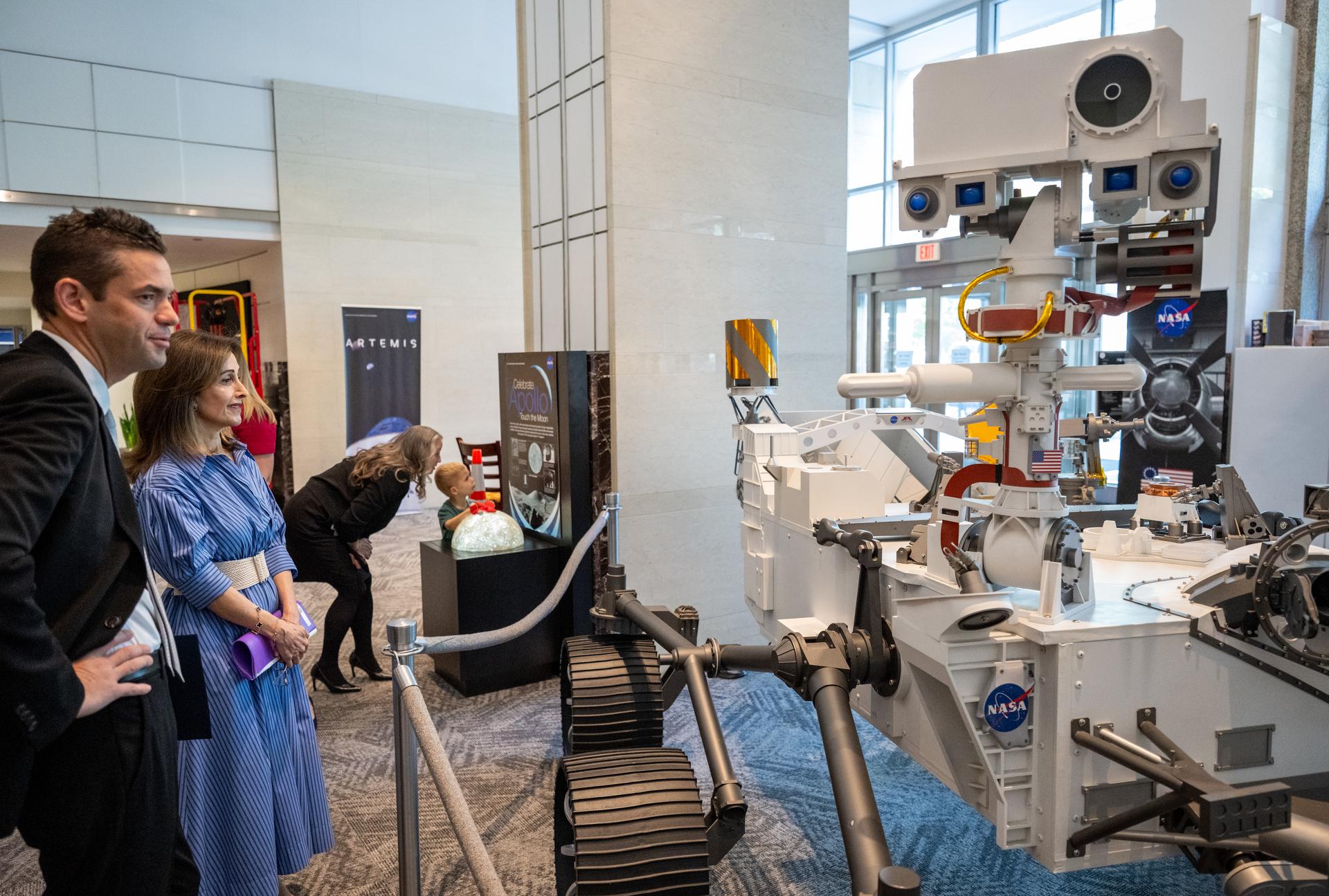 NASA Administrator Jared Isaacman shows Ambassador of Jordan to the United States Dina Kawar a model of the Mars 2020 Perseverance Rover prior to an Artemis Accords signing ceremony Thursday, April 23, 2026, at the Mary W. Jackson NASA Headquarters building in Washington. The Hashemite Kingdom of Jordan is the 63rd country to sign the Artemis Accords, which establish a practical set of principles to guide space exploration cooperation among nations participating in NASA’s Artemis program. Photo Credit: (NASA/Keegan Barber)