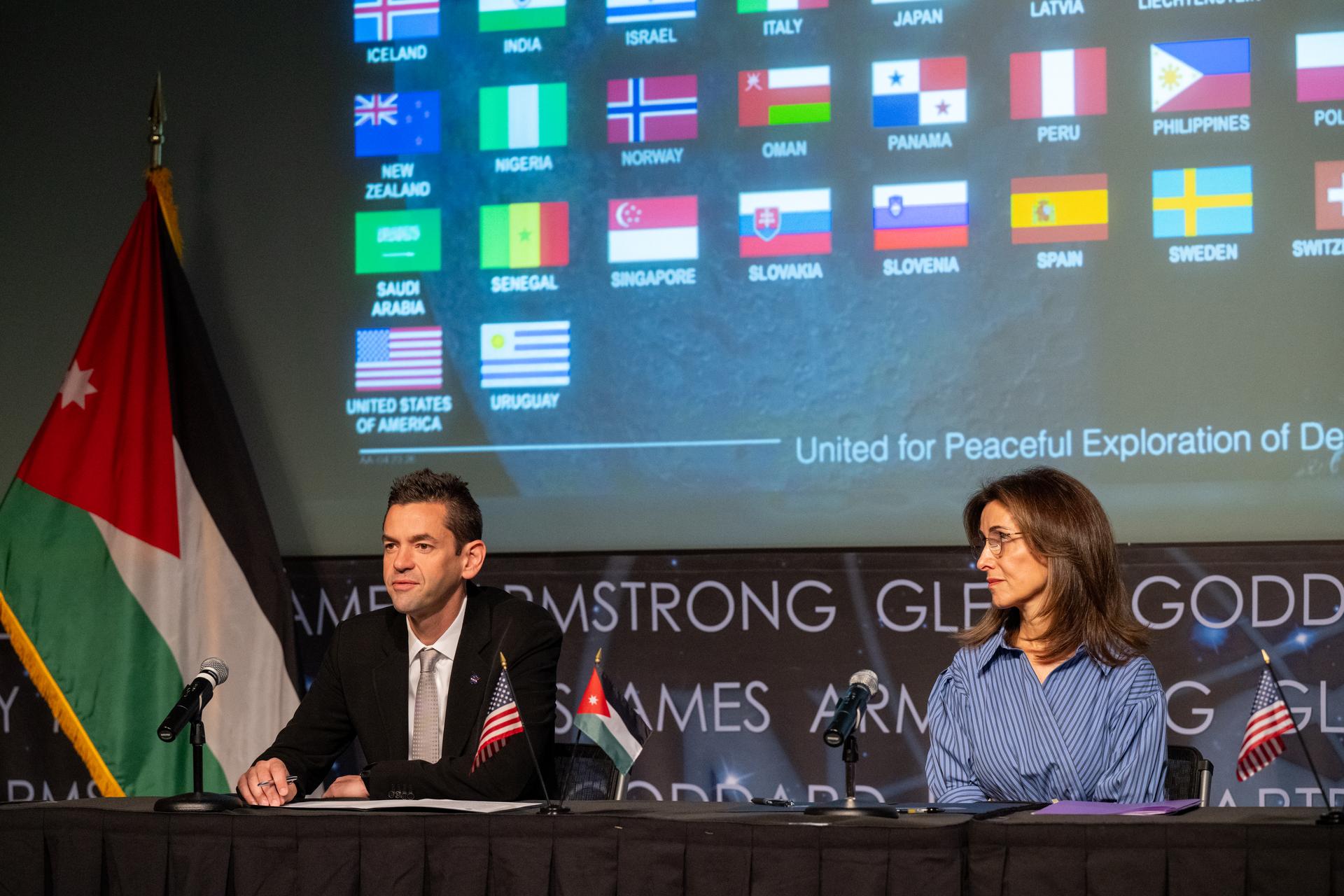 NASA Administrator Jared Isaacman, left, delivers remarks during an Artemis Accords signing ceremony alongside Ambassador of Jordan to the United States Dina Kawar, right, Thursday, April 23, 2026, at the Mary W. Jackson NASA Headquarters building in Washington. The Hashemite Kingdom of Jordan is the 63rd country to sign the Artemis Accords, which establish a practical set of principles to guide space exploration cooperation among nations participating in NASA’s Artemis program. Photo Credit: (NASA/Keegan Barber)