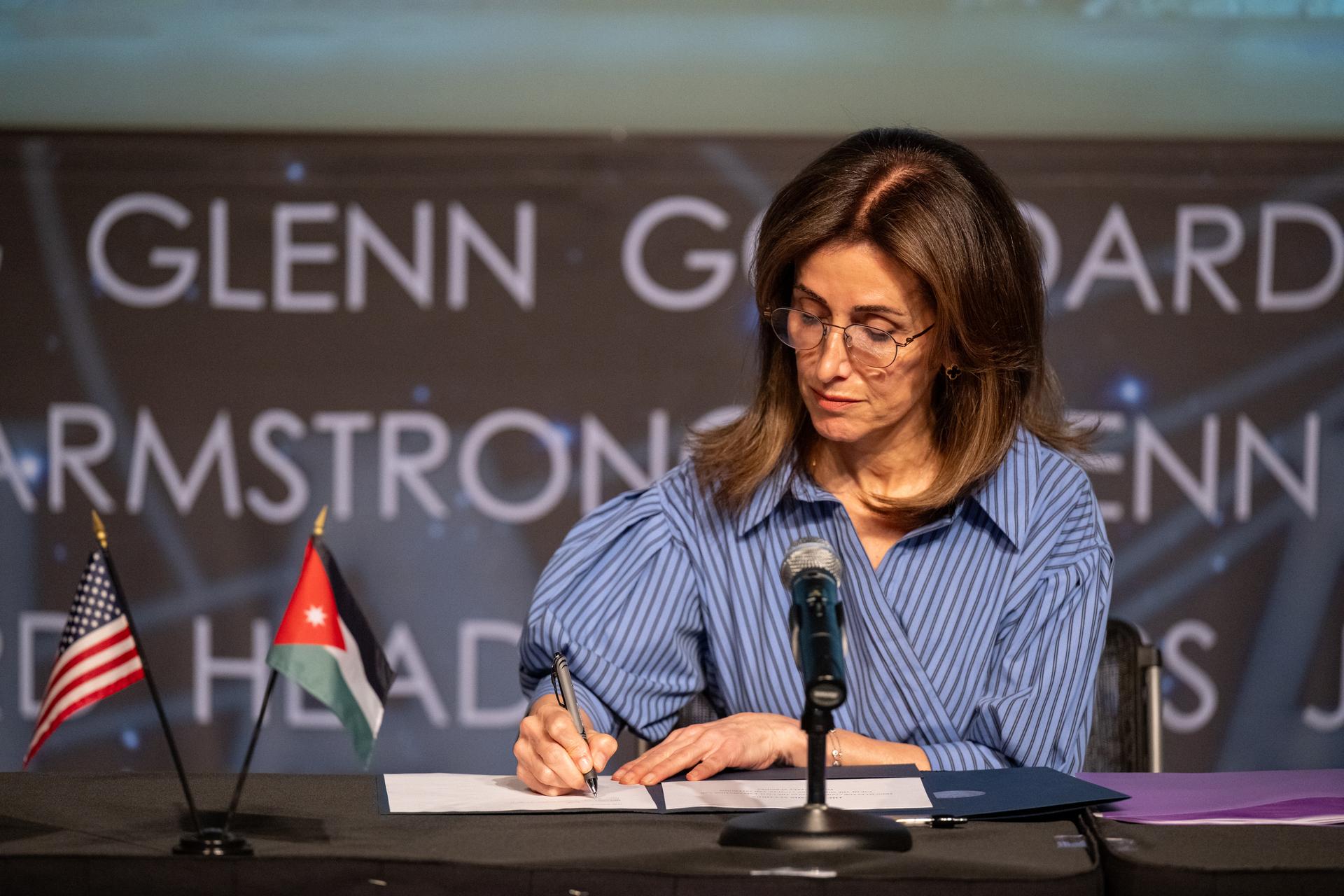 Ambassador of Jordan to the United States Dina Kawar signs the Artemis Accords Thursday, April 23, 2026, at the Mary W. Jackson NASA Headquarters building in Washington. The Hashemite Kingdom of Jordan is the 63rd country to sign the Artemis Accords, which establish a practical set of principles to guide space exploration cooperation among nations participating in NASA’s Artemis program. Photo Credit: (NASA/Keegan Barber)
