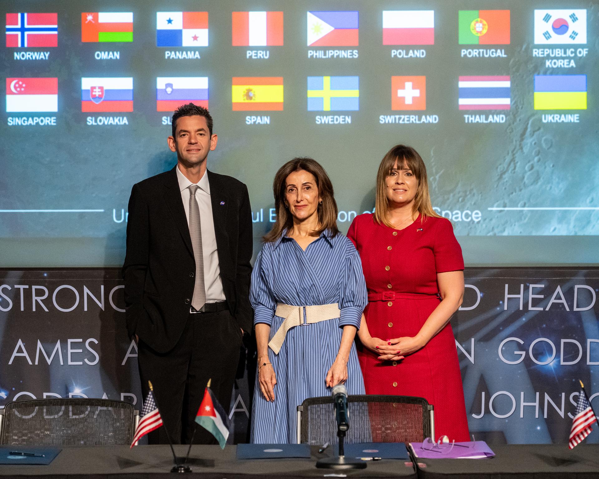 From left to right, NASA Administrator Jared Isaacman, Ambassador of Jordan to the United States Dina Kawar, and Acting Principal Deputy Assistant Secretary of State for Oceans and International Environmental and Scientific Affairs Ruth Perry, pose for a photo following an Artemis Accords signing ceremony Thursday, April 23, 2026, at the Mary W. Jackson NASA Headquarters building in Washington. The Hashemite Kingdom of Jordan is the 63rd country to sign the Artemis Accords, which establish a practical set of principles to guide space exploration cooperation among nations participating in NASA’s Artemis program. Photo Credit: (NASA/Keegan Barber)