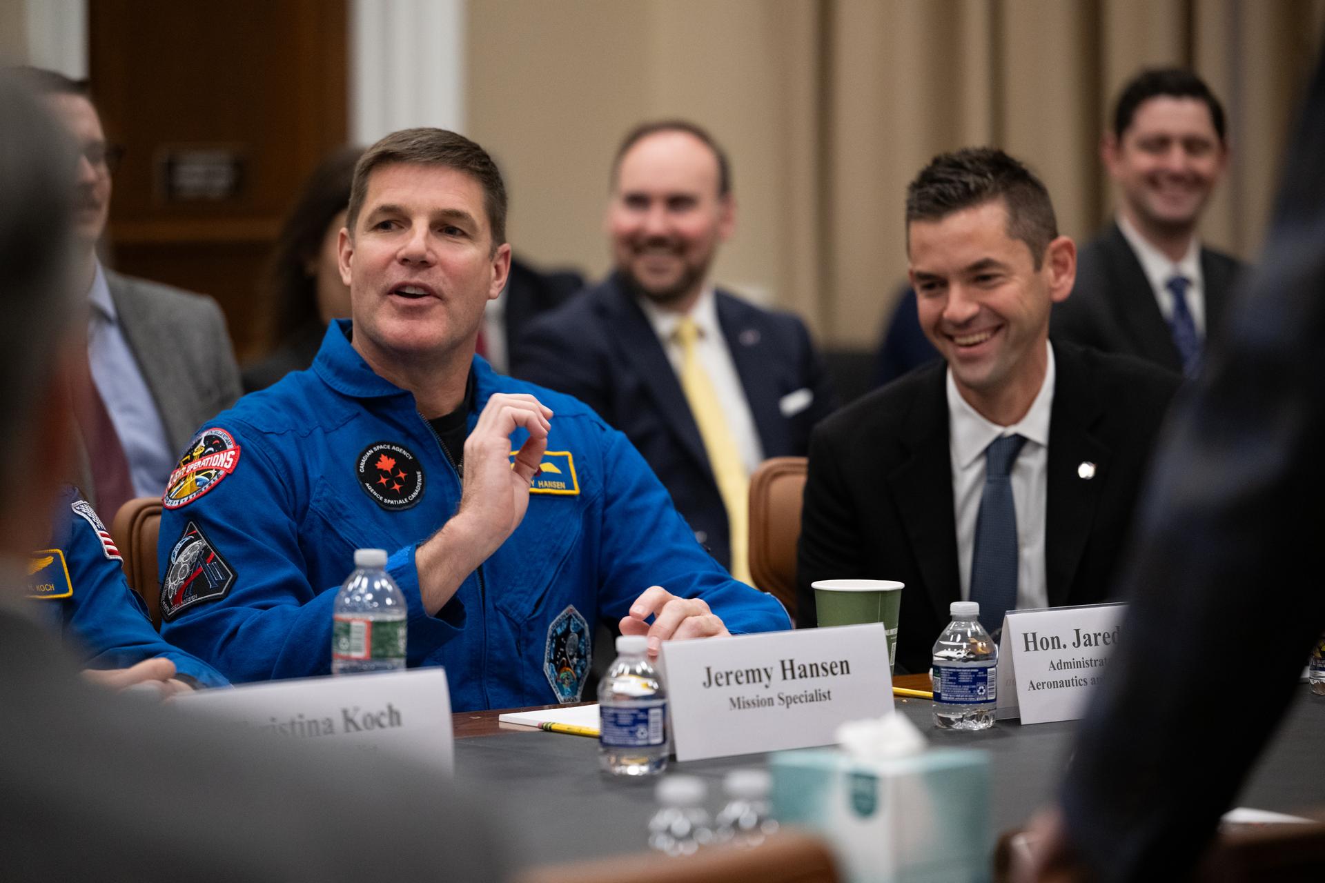 CSA (Canadian Space Agency) astronaut Jeremy Hansen, Artemis II mission specialist, speaks with members of the House Appropriations Subcommittee on Commerce Justice, Science, and Related Agencies alongside fellow crew mates NASA astronauts Victor Glover, pilot; Reid Wiseman, commander; Christina Koch, mission specialist; and NASA Administrator Jared Isaacman, Tuesday, May 12, 2026, at the Rayburn House Office Building in Washington. NASA’s Artemis II mission took Wiseman, Glover, Koch, and Hansen on a nearly 10-day journey around the Moon and back to Earth in April 2026. Photo Credit: (NASA/Joel Kowsky)