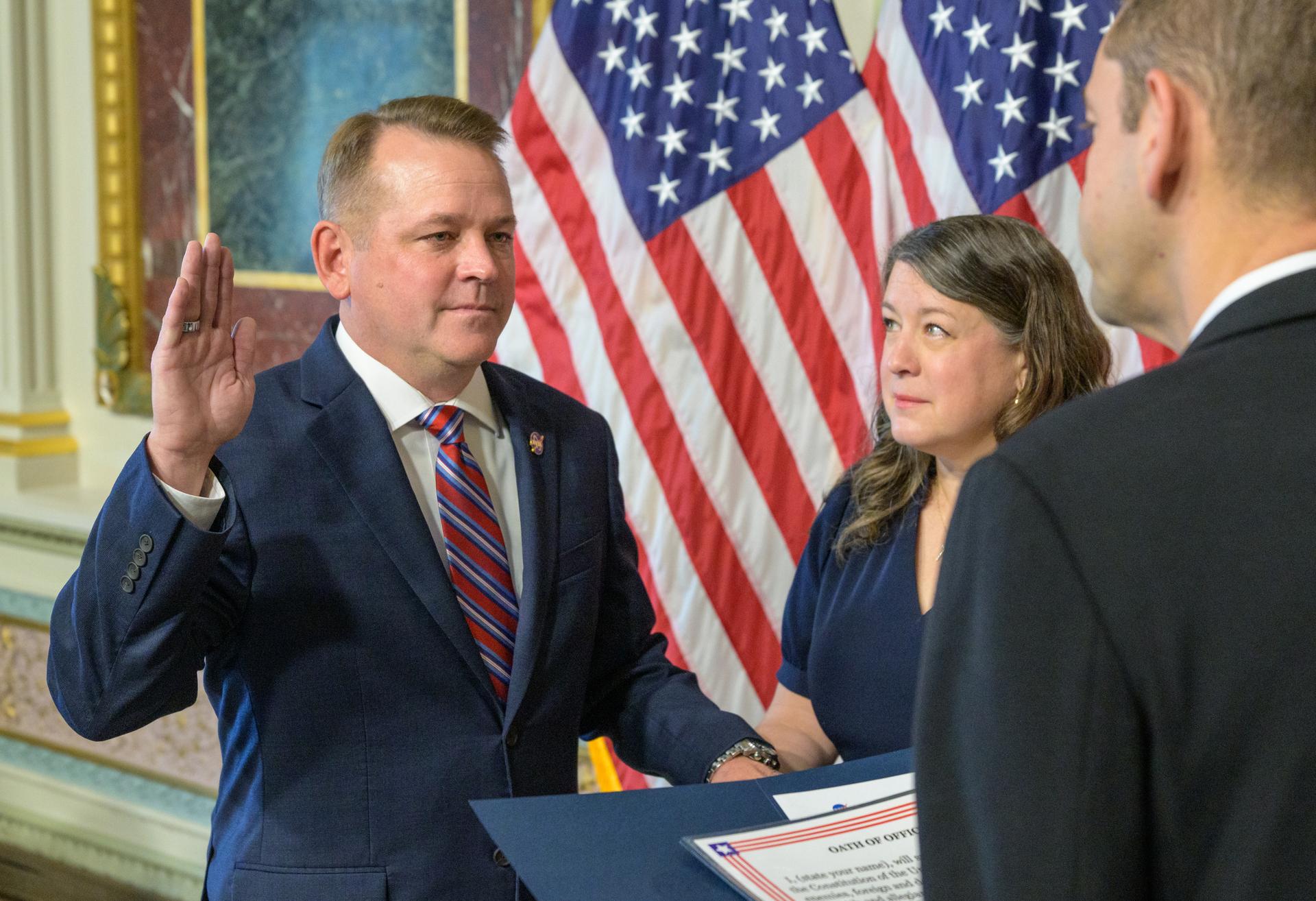 Matt Anderson, left, joined by his wife Christine, is sworn in as the 16th Deputy Administrator of NASA, by NASA Administrator Jared Isaacman, Thursday, May 21, 2026, at the Eisenhower Executive Office Building in Washington. Photo Credit: (NASA/Bill Ingalls)