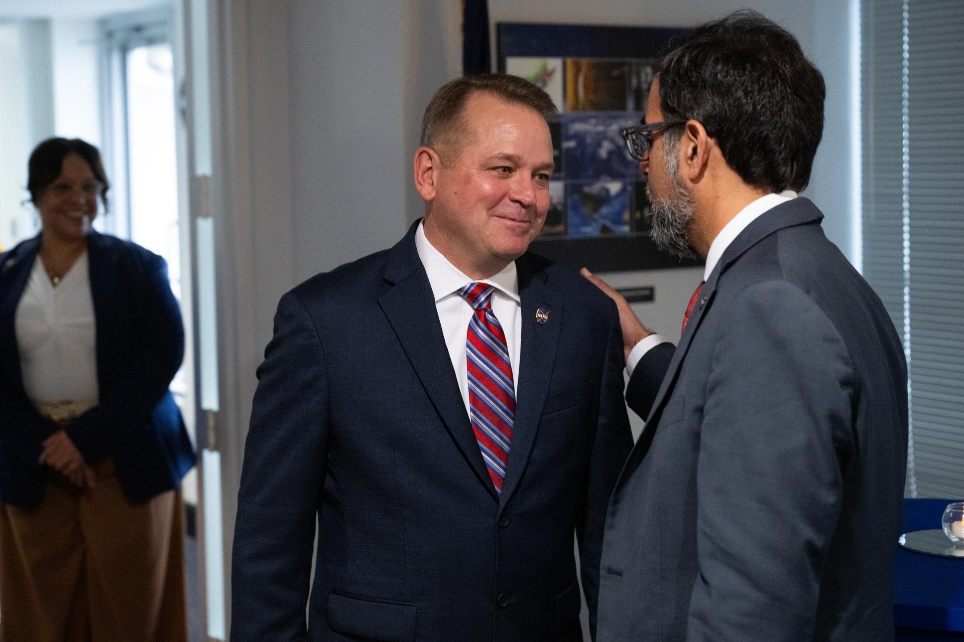 NASA Associate Administrator Amit Kshatriya, right, welcomes NASA Deputy Administrator Matt Anderson to NASA Headquarters along with other agency leadership, Thursday, May 21, 2026, at the Mary W. Jackson NASA Headquarters building in Washington. Anderson was sworn-in as the agency’s 16th Deputy Administrator during a ceremony at the Eisenhower Executive Office Building earlier this morning. Photo Credit: (NASA/Joel Kowsky)