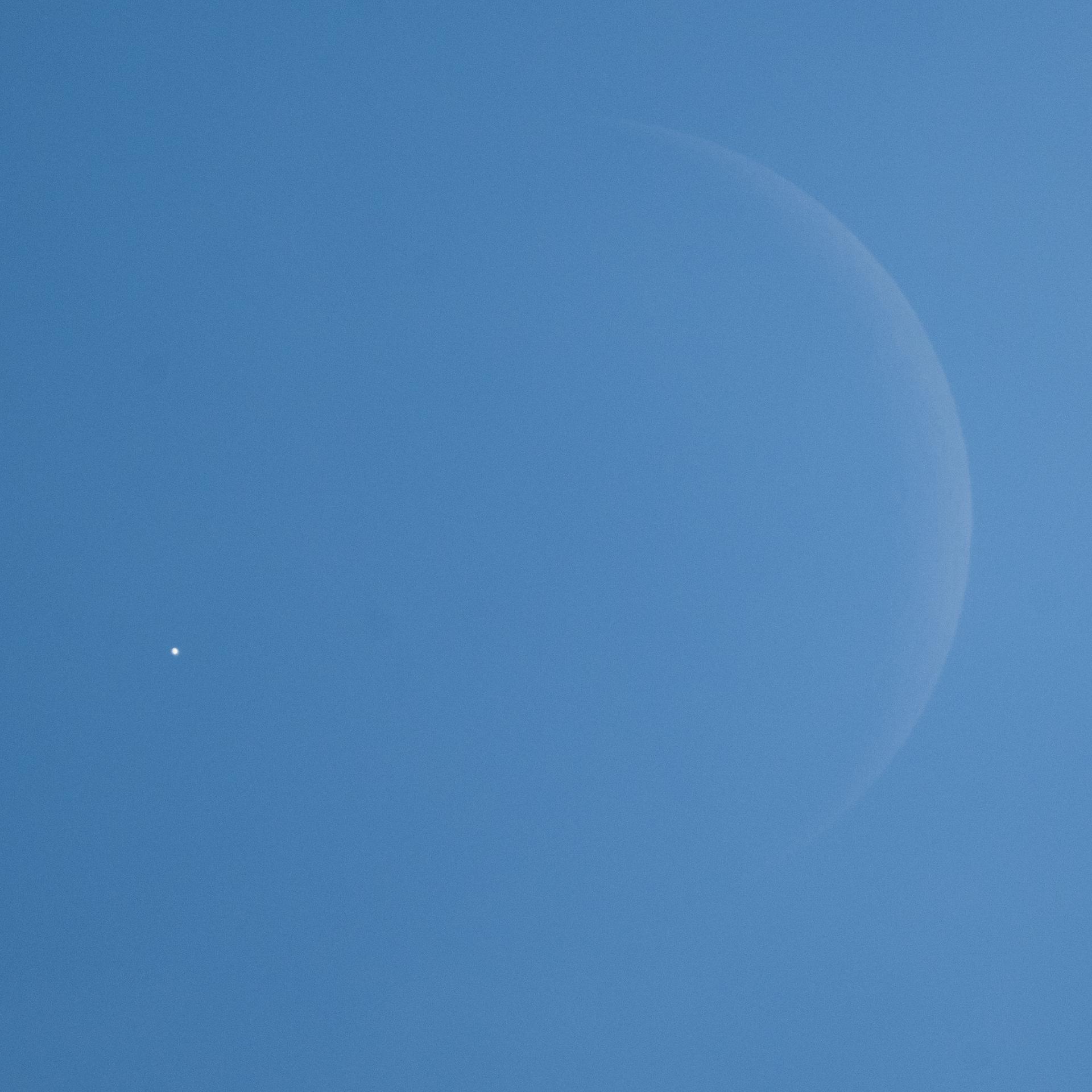 Venus is seen as disappears behind the Moon, at the start of occultation, on Wednesday, June 17, 2026, from the Mary W. Jackson NASA Headquarters building in Washington. The Moon occulted, or passed in front of, Venus for the first of three time this year.  Photo Credit: (NASA/Joel Kowsky)