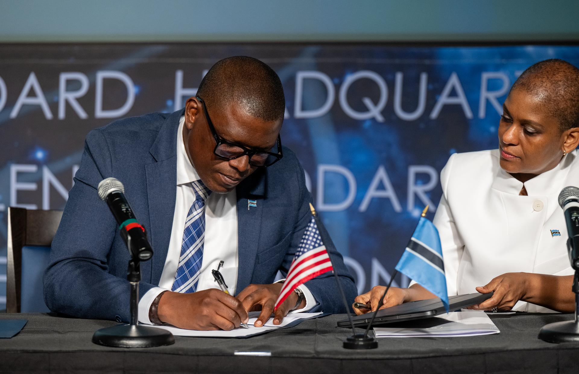 Minister of Communications and Innovation David Tshere, left, signs the Artemis Accords during a ceremony with the Republic of Botswana alongside Acting Ambassador of the Republic of Botswana to the United States Mabedi Ngwenya, right, Thursday, June 25, 2026, at the Mary W. Jackson NASA Headquarters building in Washington. The Republic of Botswana is the 68th country to sign the Artemis Accords, which establish a practical set of principles to guide space exploration cooperation among nations participating in NASA’s Artemis program. Photo Credit: (NASA/Keegan Barber)