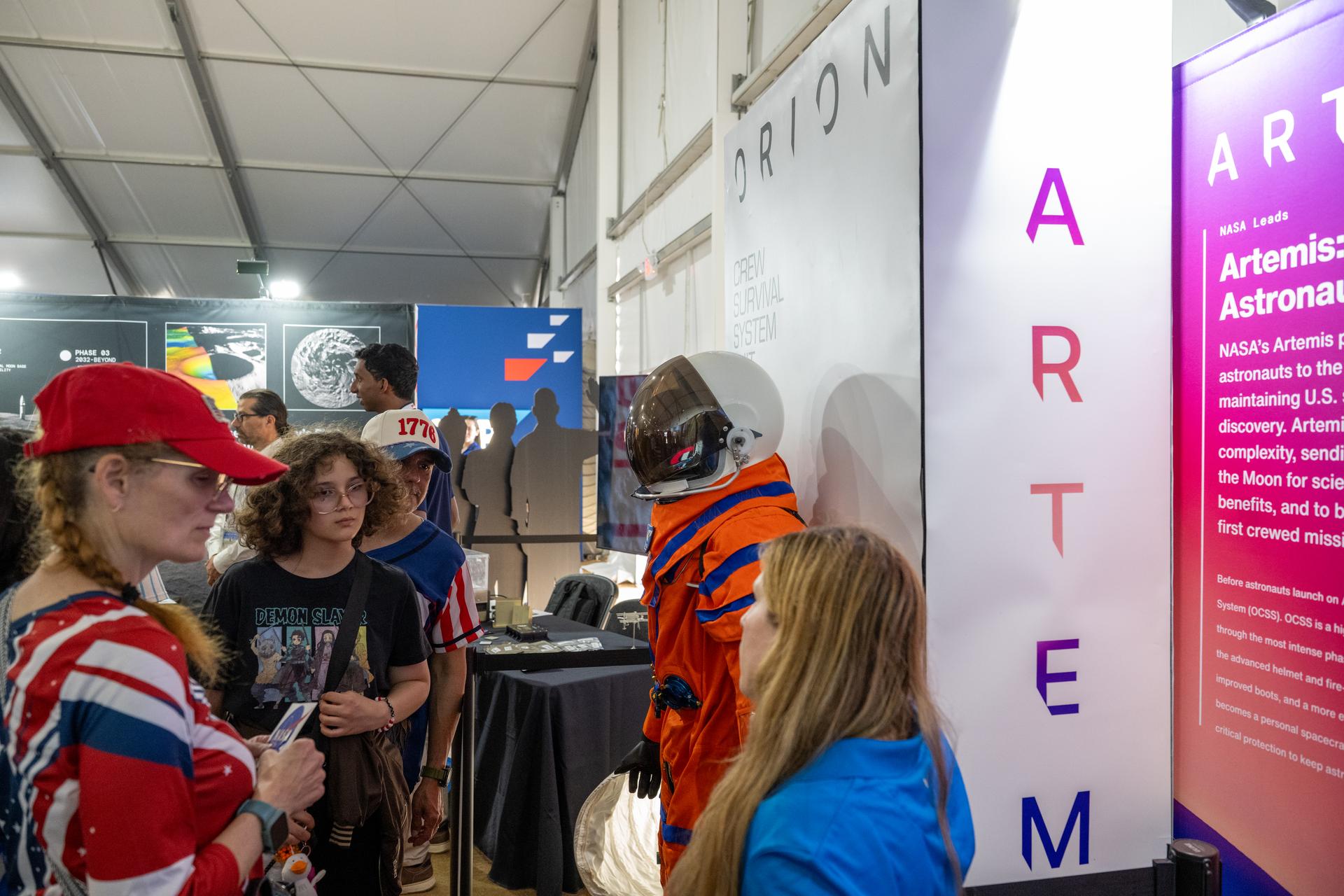 Visitors to the Great American State Fair are seen as they view exhibits in the NASA Pavilion, Thursday, June 25, 2026, on the National Mall in Washington, D.C.  Photo Credit: (NASA/Keegan Barber)