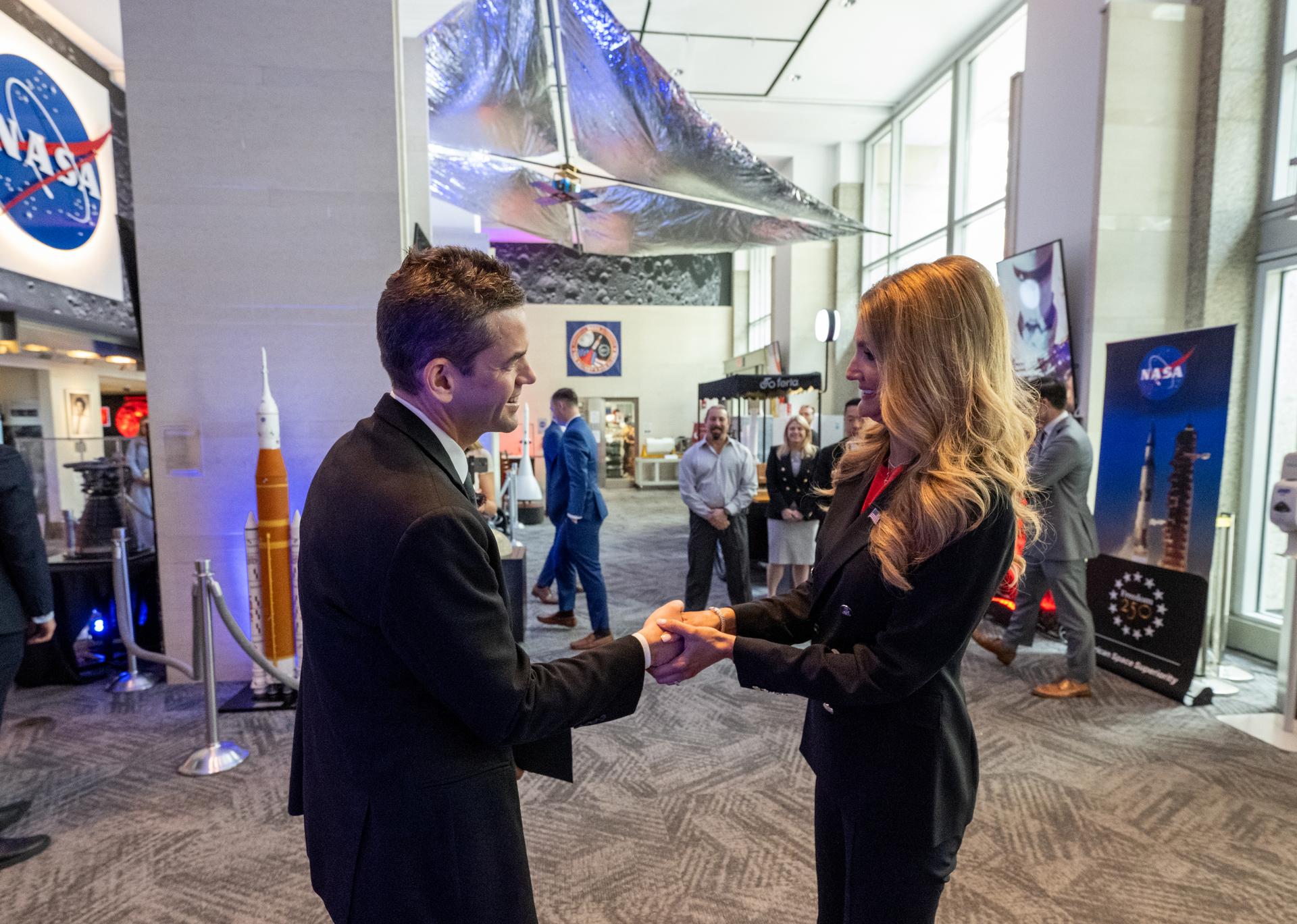 NASA Administrator Jared Isaacman, left, greets Administrator of the Small Business Administration Kelly Loeffler, right, prior to a Memorandum of Agreement signing ceremony Monday, June 29, 2026, at the Mary W. Jackson NASA Headquarters building in Washington. This Memorandum of Agreement will provide the framework for NASA and the Small Business Administration Office of Investment and Innovation to support the growth of the Small Business Investment Company-NASA Initiative. Photo Credit: (NASA/Keegan Barber)