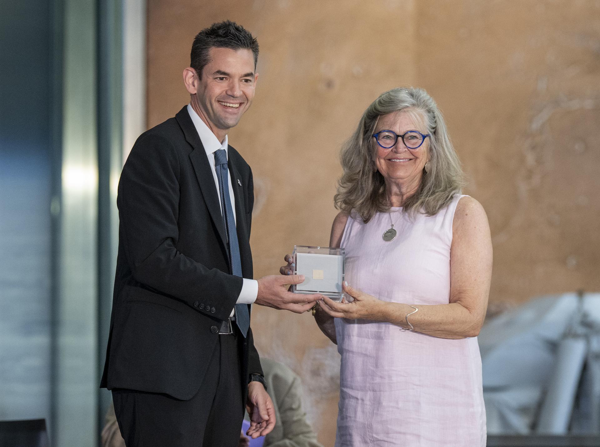 NASA Administrator Jared Isaacman presents a swatch of muslin fabric from the original Wright Flyer the Wright Brothers used to make the first powered flight in 1903 to great-grandniece Amanda Wright Lane during the Smithsonian’s National Air and Space Museum rededication ceremony Wednesday, July 1, 2026, in Washington. The swatch is being returned to the museum after having been flown aboard NASA’s Artemis II mission around the Moon and back to Earth in April 2026. Photo Credit: (NASA/Keegan Barber)