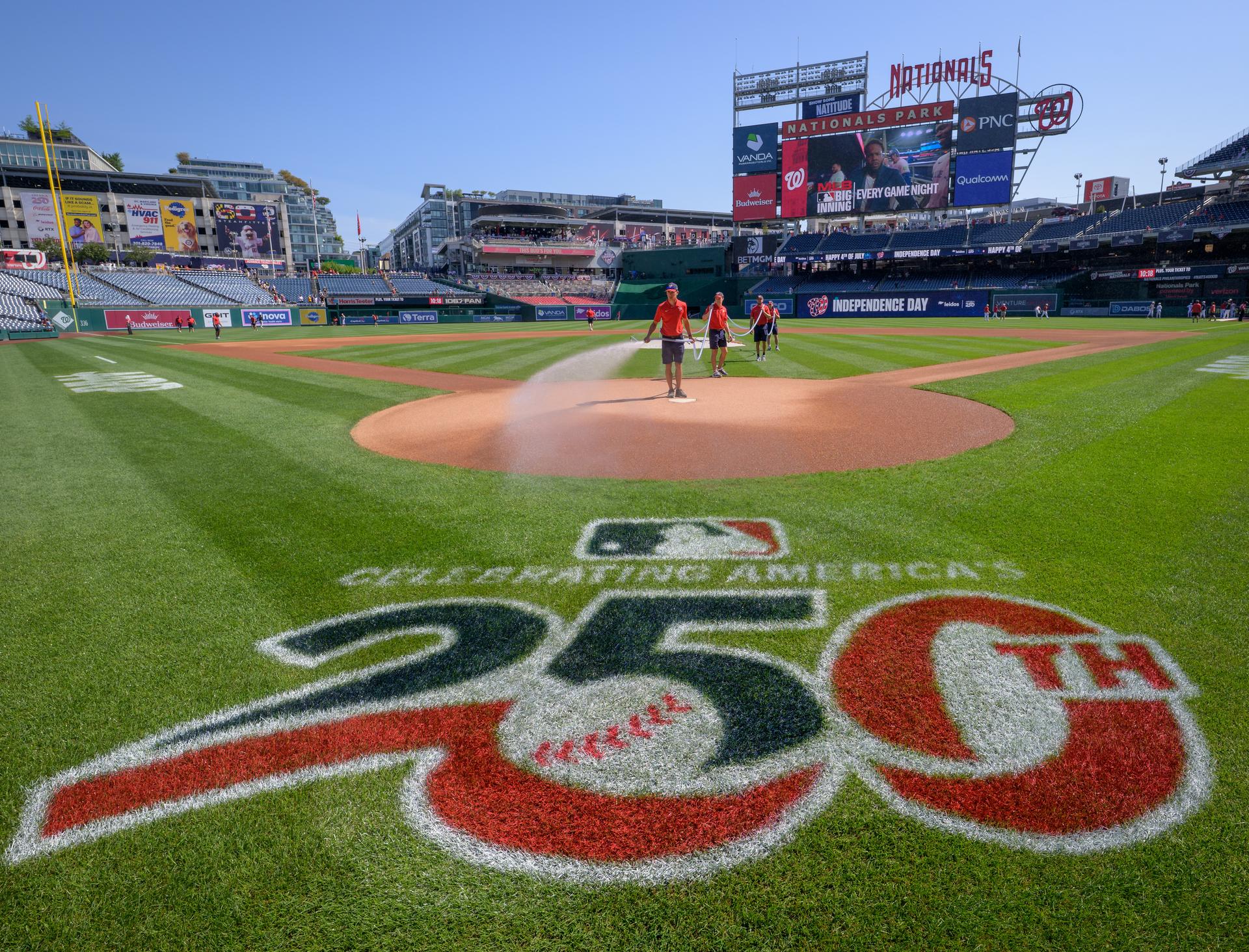 Grounds teams prepare the field before the start of a baseball game between the Pittsburgh Pirates and the Washington Nationals, Saturday, July 4, 2026, at Nationals Park in Washington. NASA’s Artemis II mission crew; NASA astronauts Reid Wiseman, commander; Victor Glover, pilot; Christina Koch, mission specialist; and CSA (Canadian Space Agency) astronaut Jeremy Hansen, mission specialist threw the ceremonial opening pitch. Photo Credit: (NASA/Bill Ingalls)